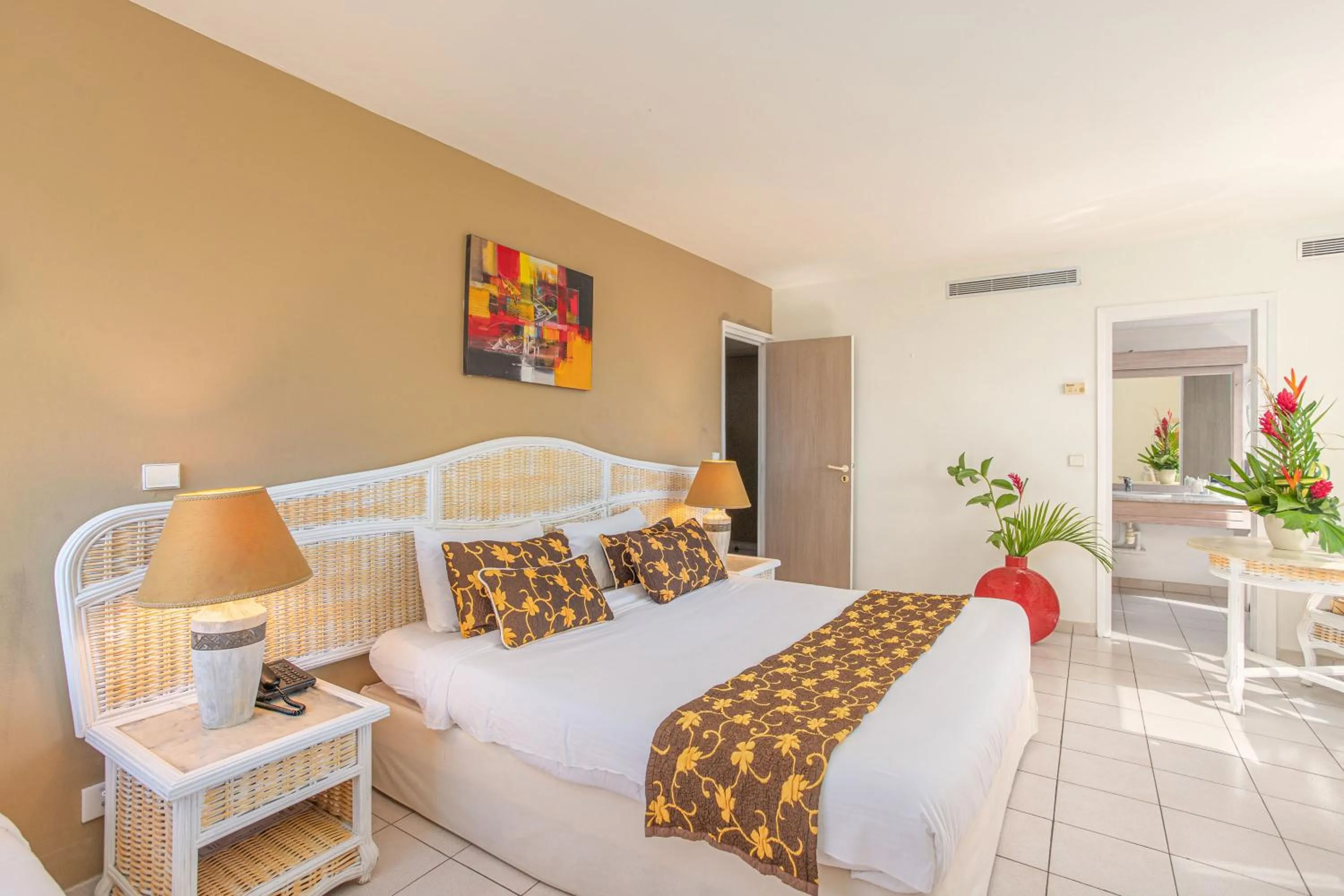 Bed in Karibea Squash Hôtel