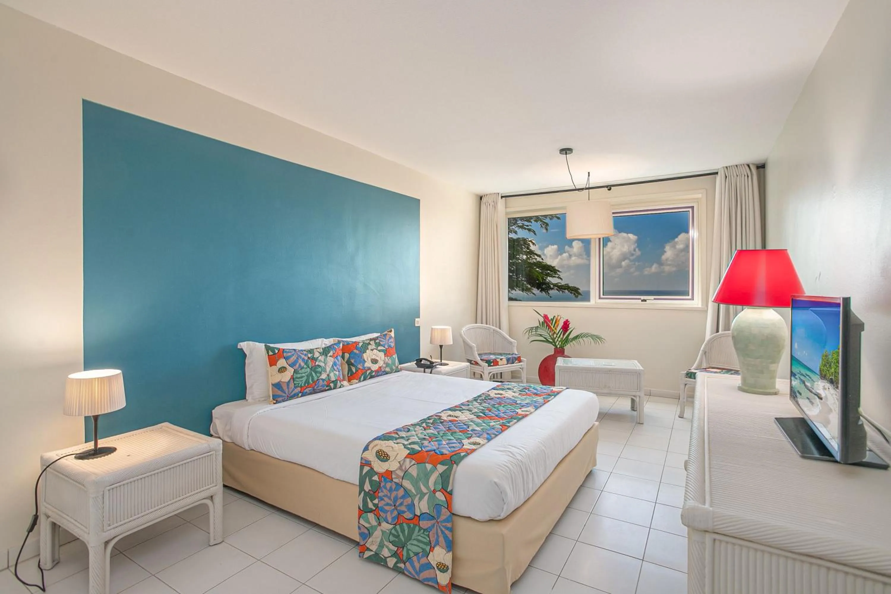 Bed in Karibea Squash Hôtel