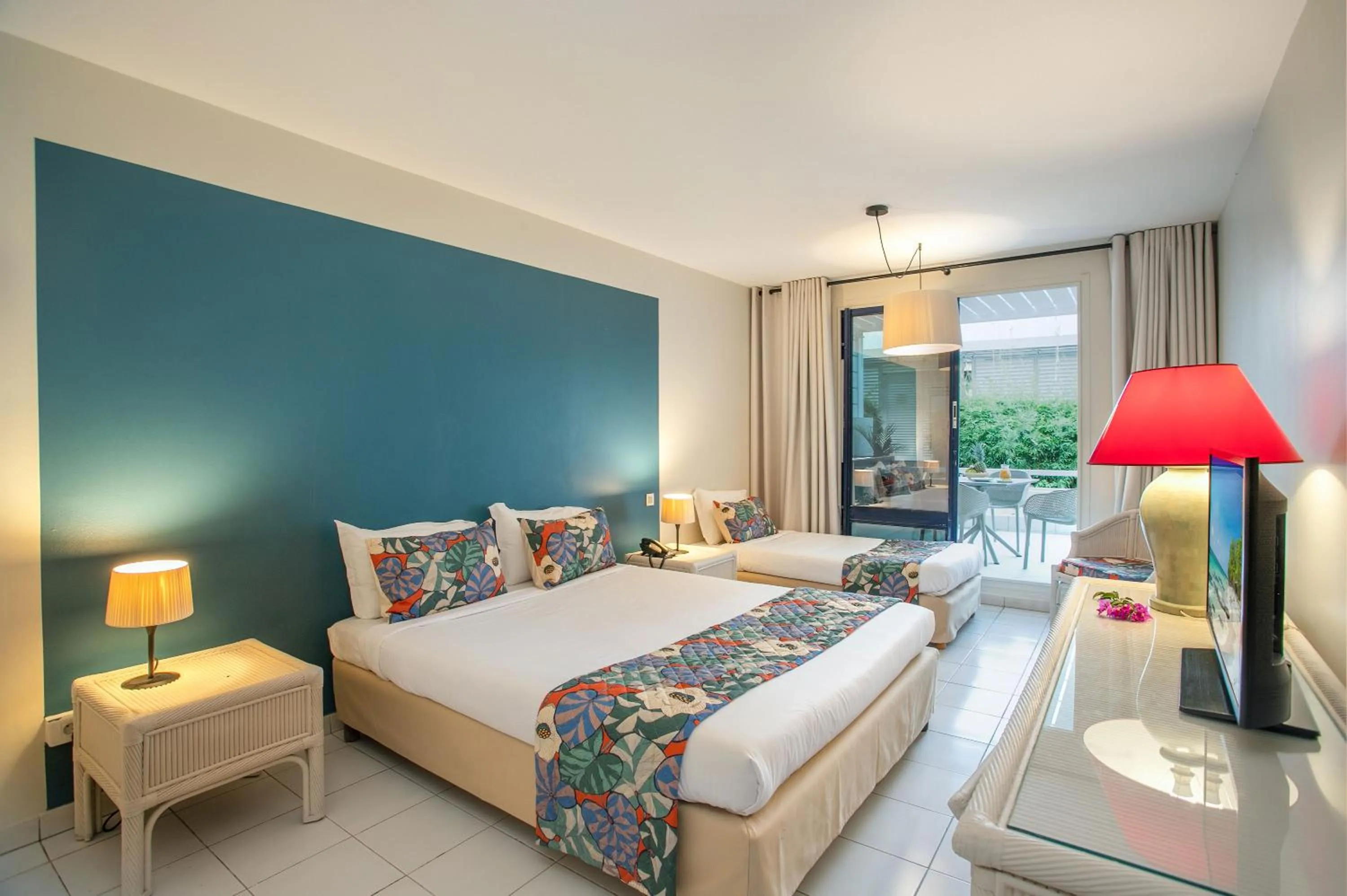 Bed in Karibea Squash Hôtel