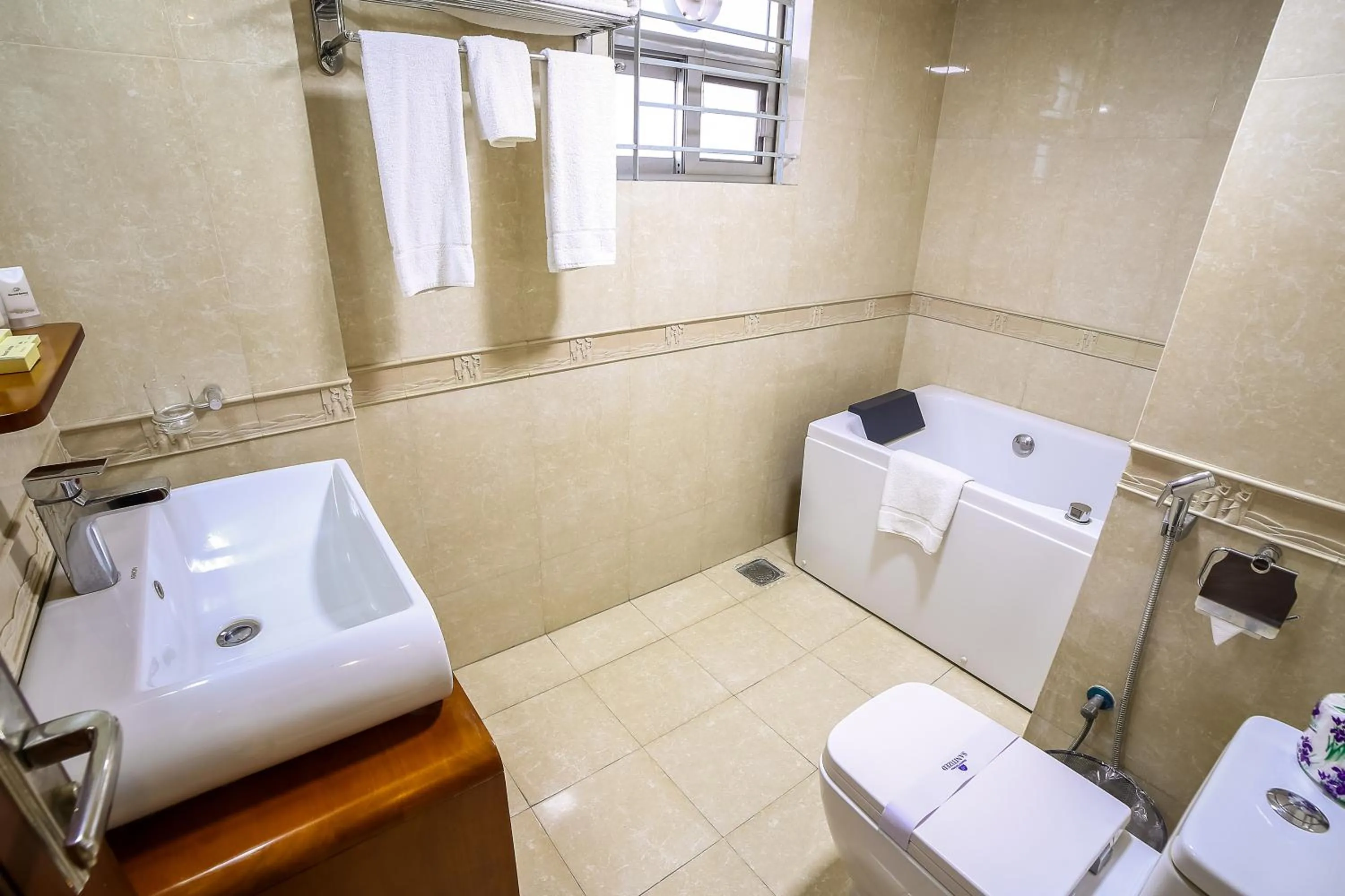 Toilet in Nascent Gardenia Luxury Suites