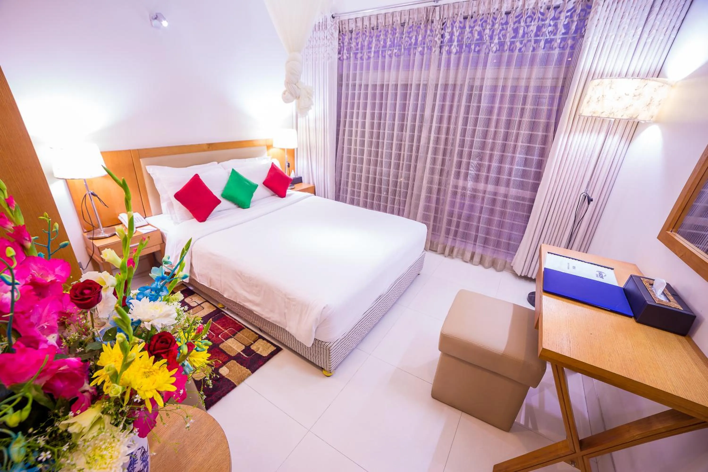 Bed in Nascent Gardenia Luxury Suites