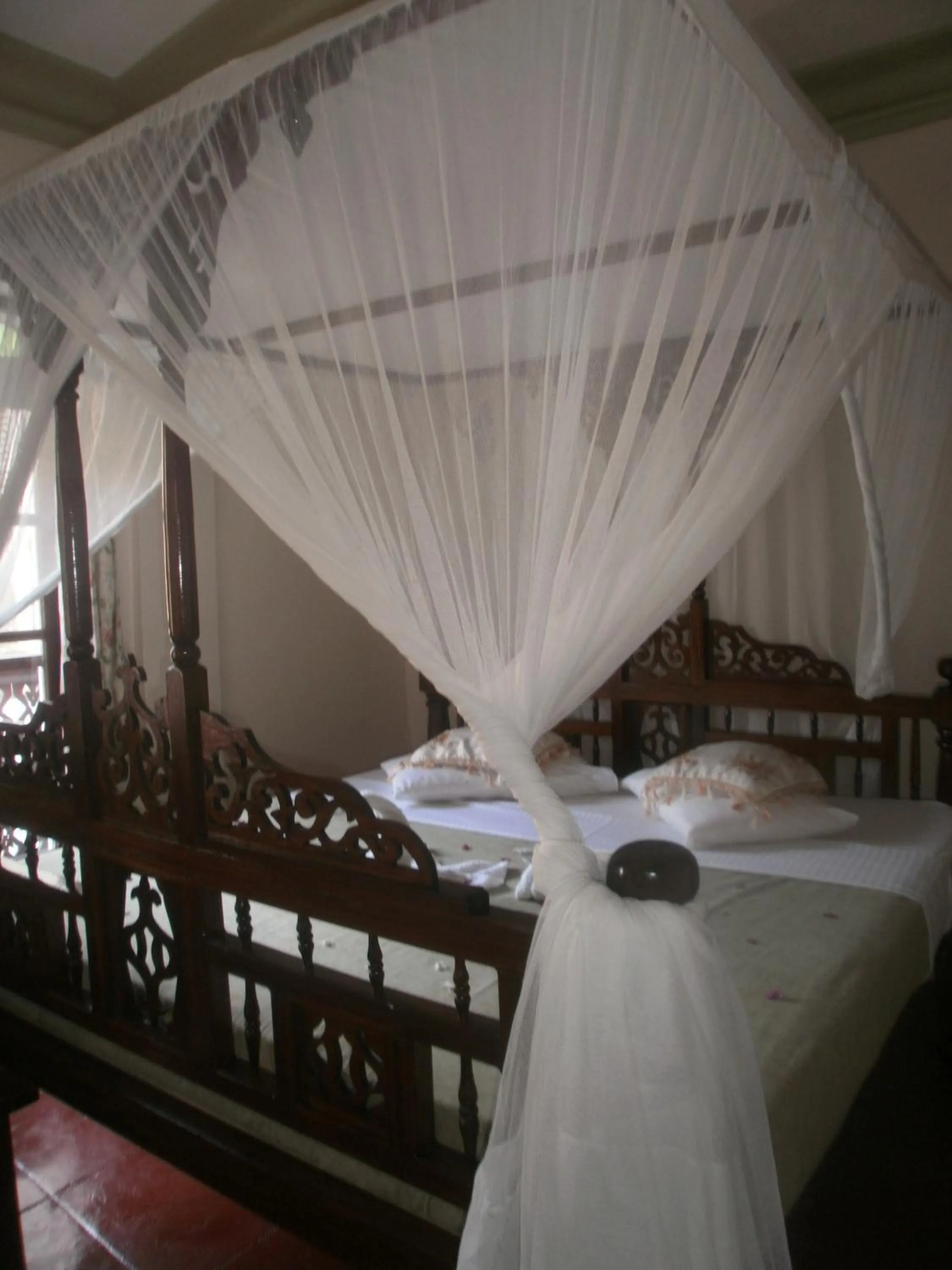 Bed in Asmini Palace Hotel