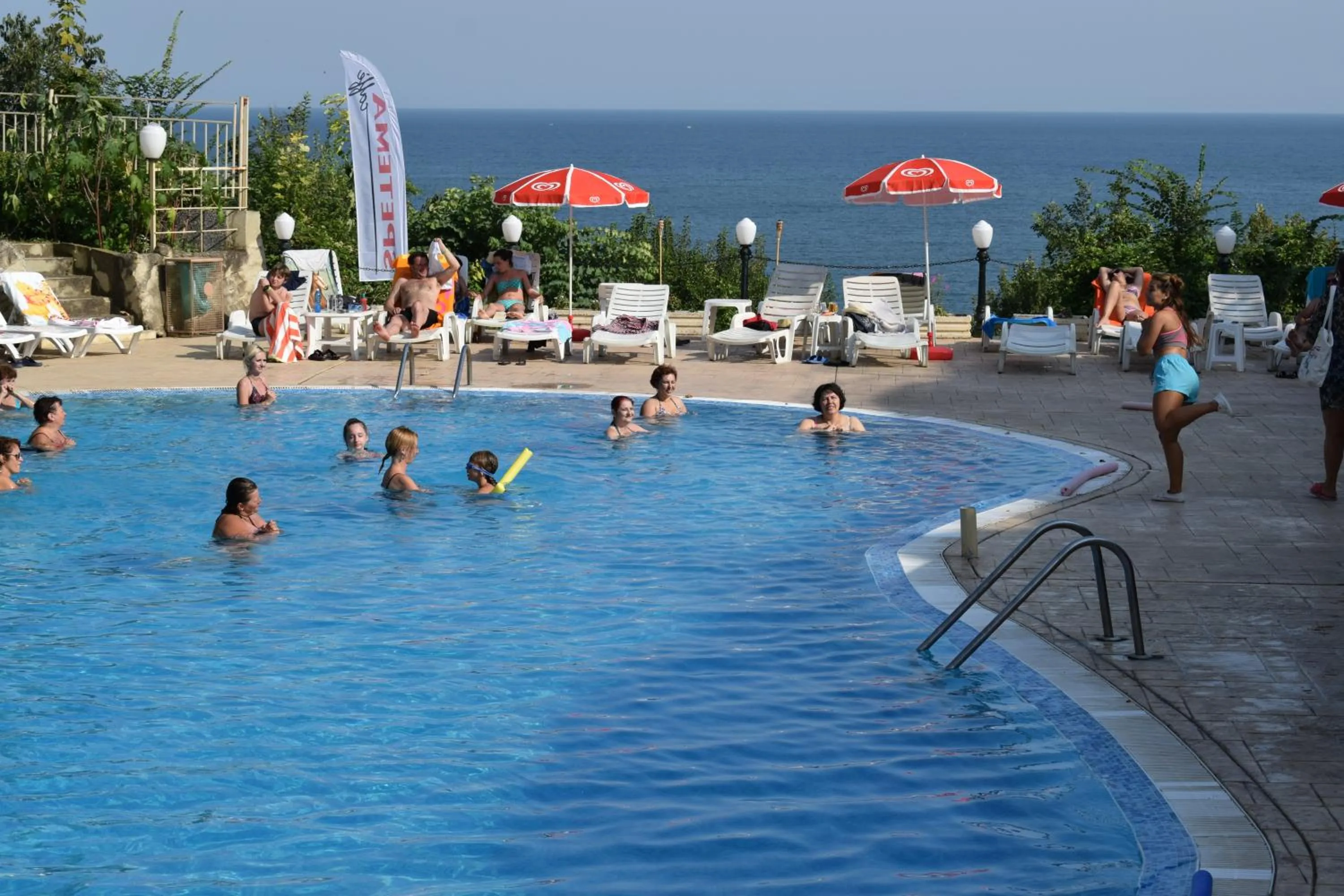 People in Ahilea Hotel - Free Pool Access