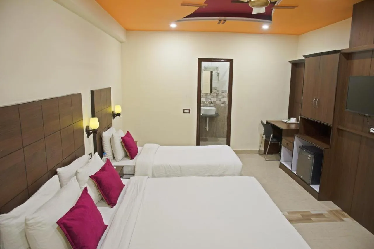 Bed in Spring Sky Mughalsarai By ShriGo Hotels