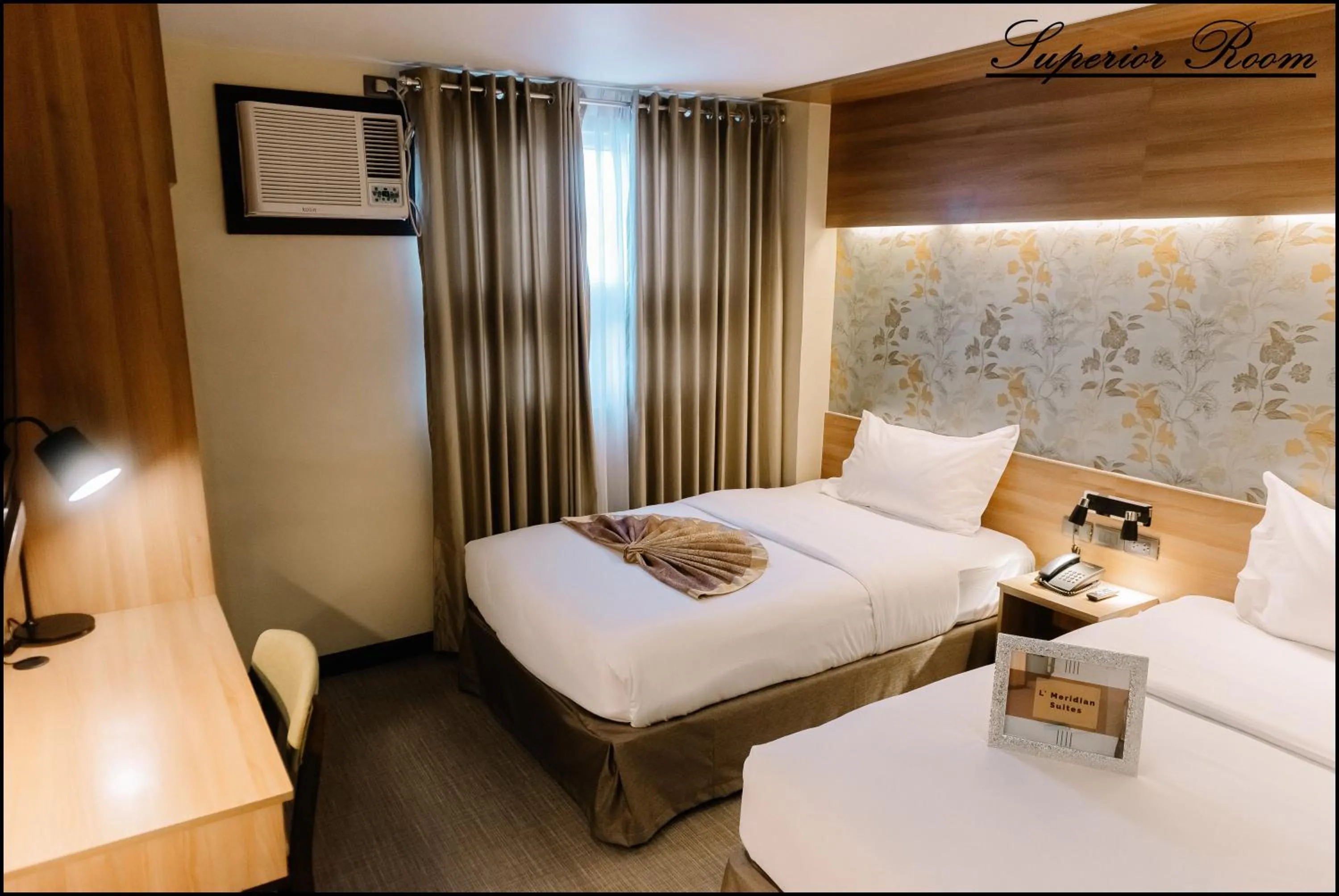 Bed in L' Meridian Suites