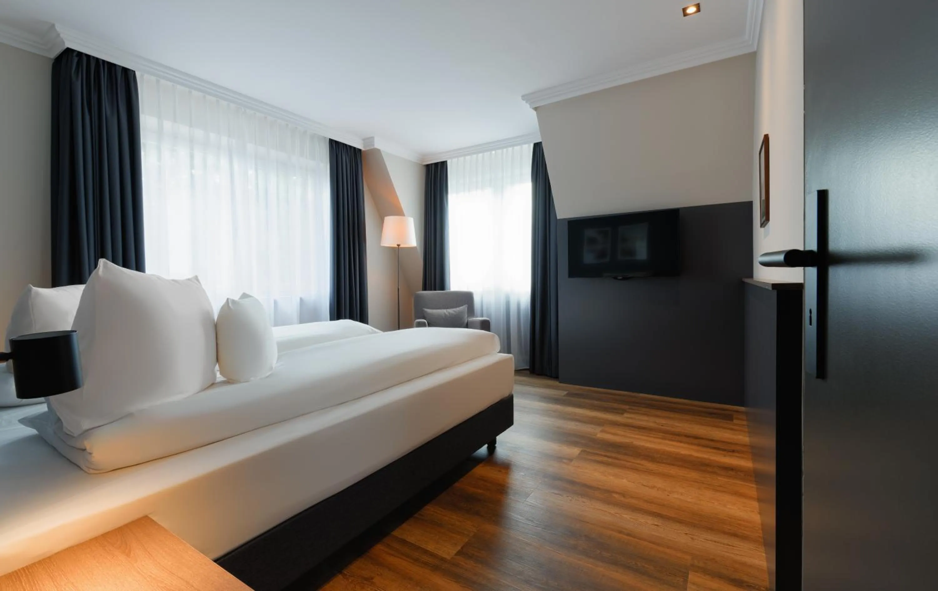 Bed in ATLANTIC Hotel Landgut Horn