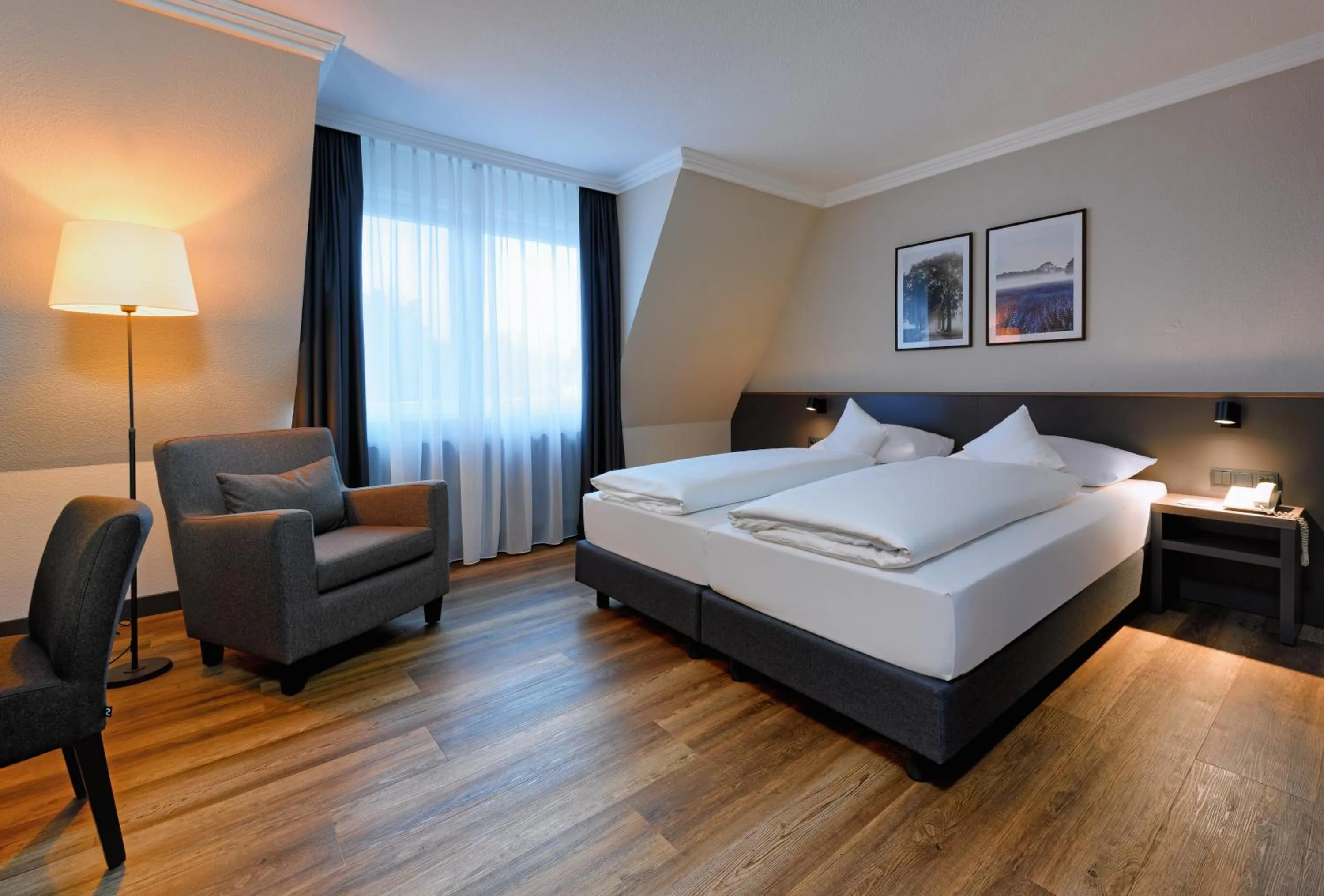 Photo of the whole room, Bed in ATLANTIC Hotel Landgut Horn