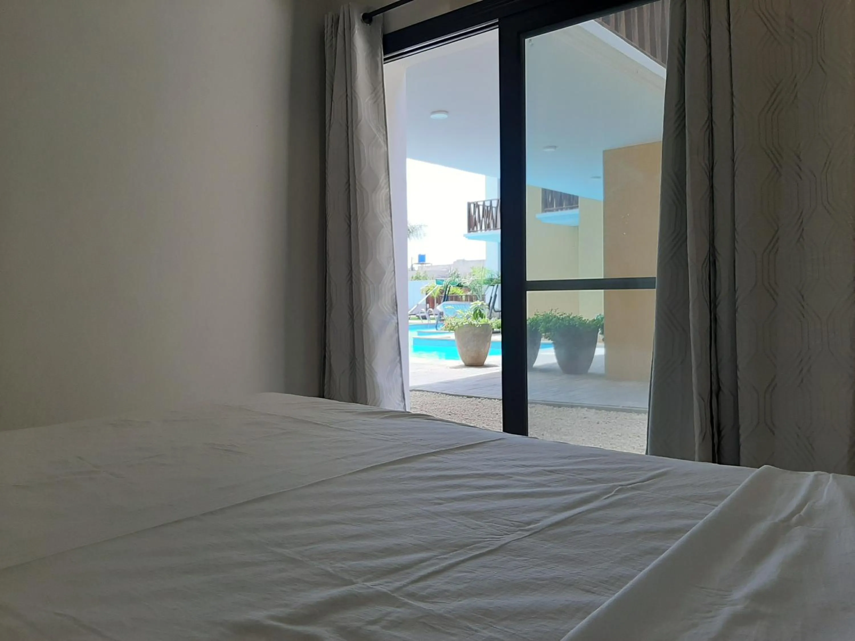 Pool view, Bed in Forest View Apartments