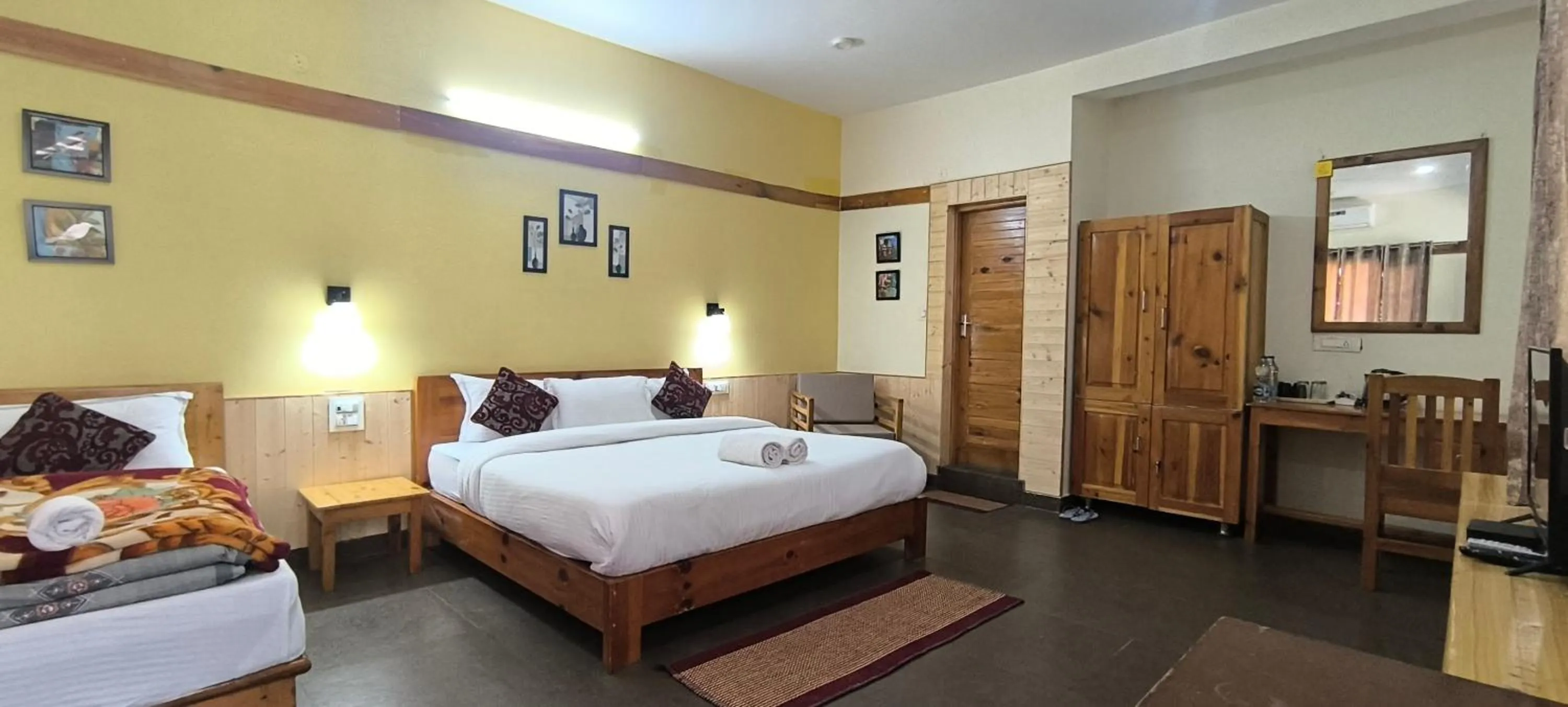 Bed in Tirthan Grand Riverside