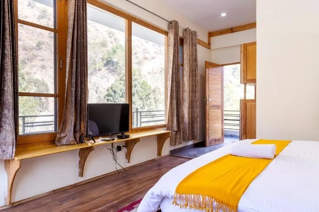 Bed in Tirthan Grand Riverside