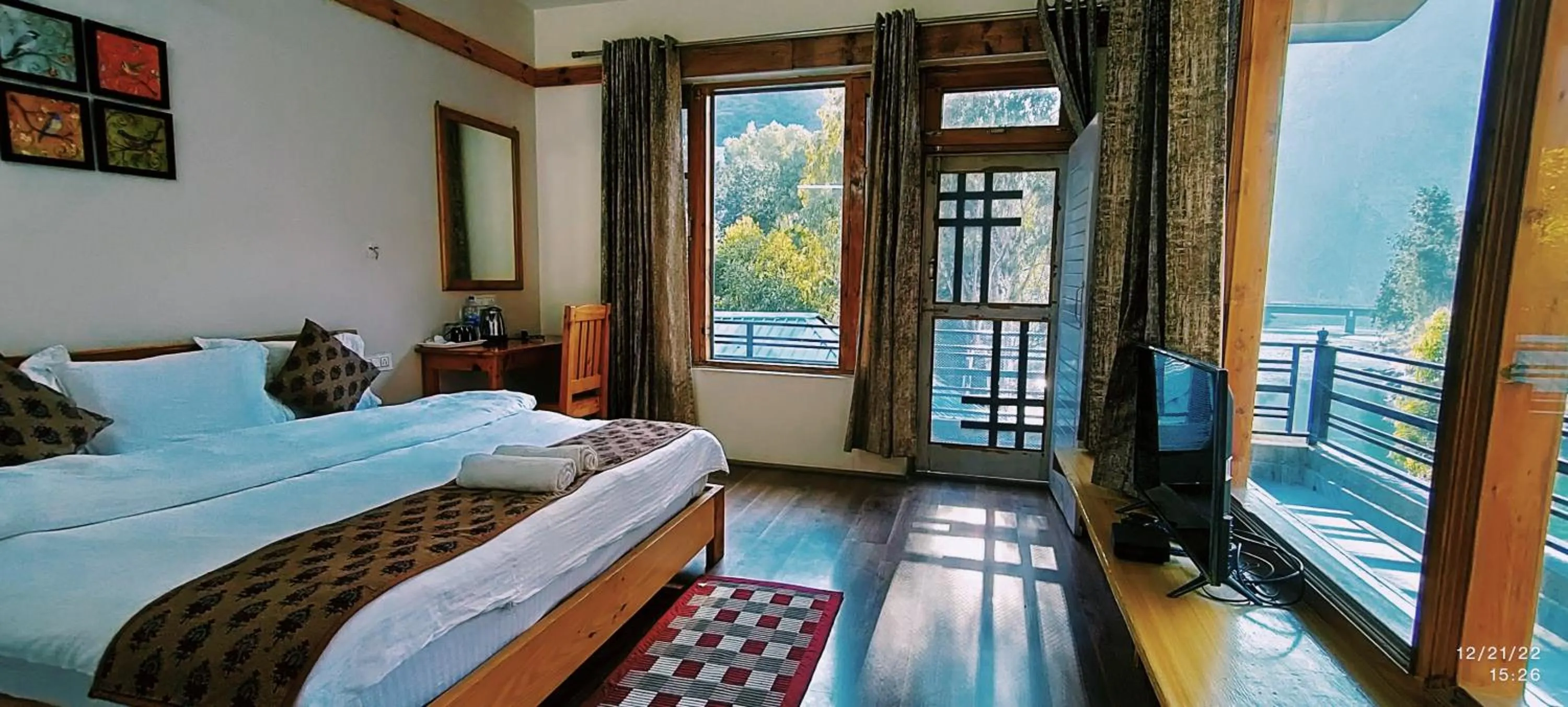 Bed in Tirthan Grand Riverside