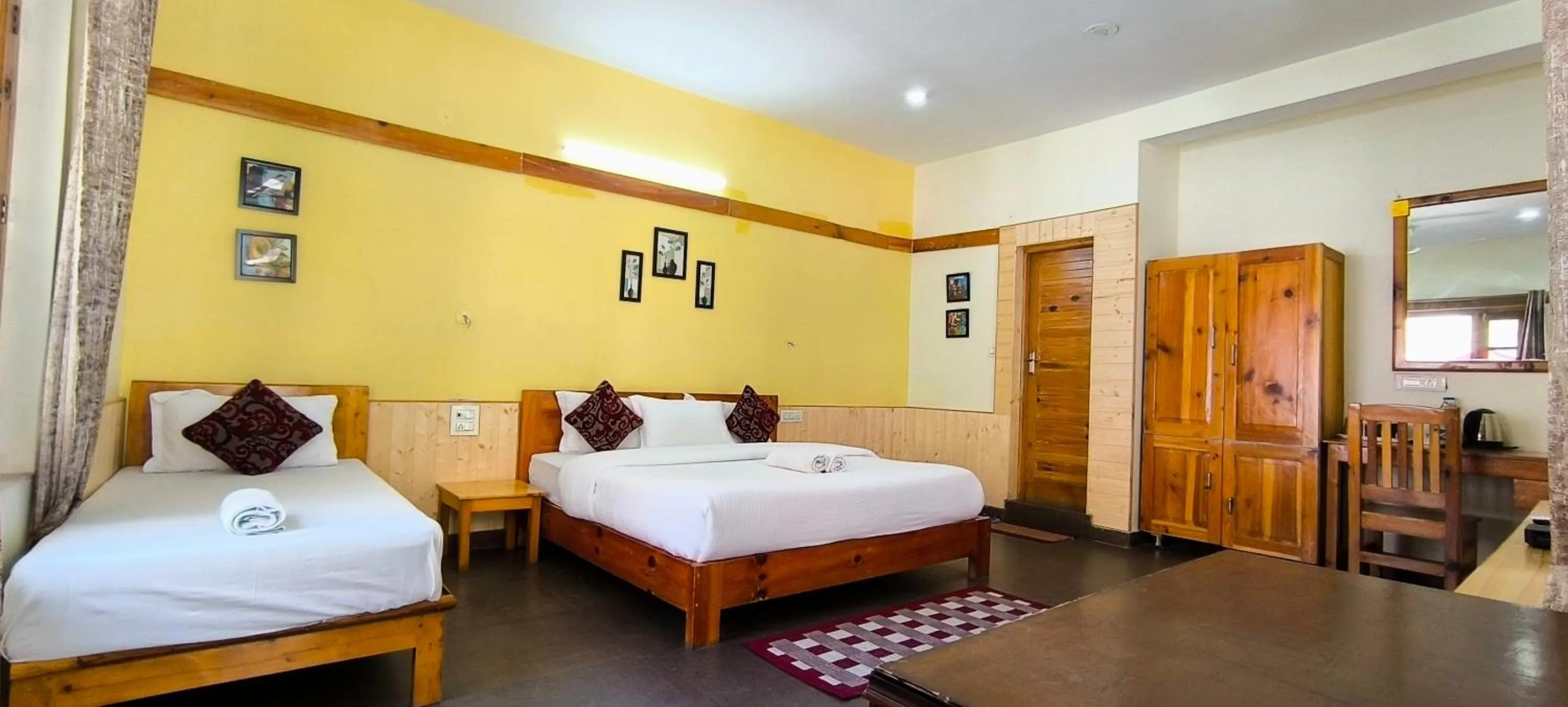 Bed in Tirthan Grand Riverside