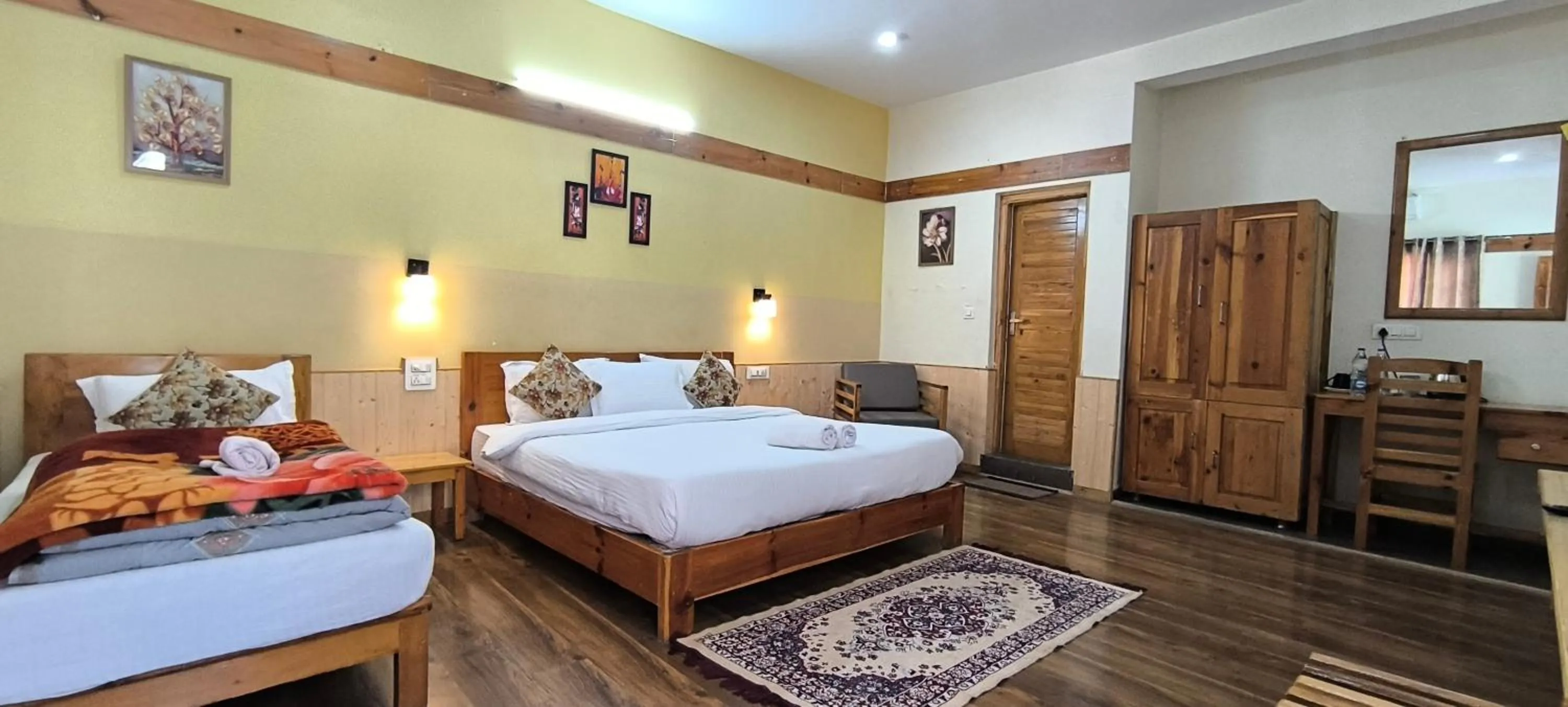 Bed in Tirthan Grand Riverside