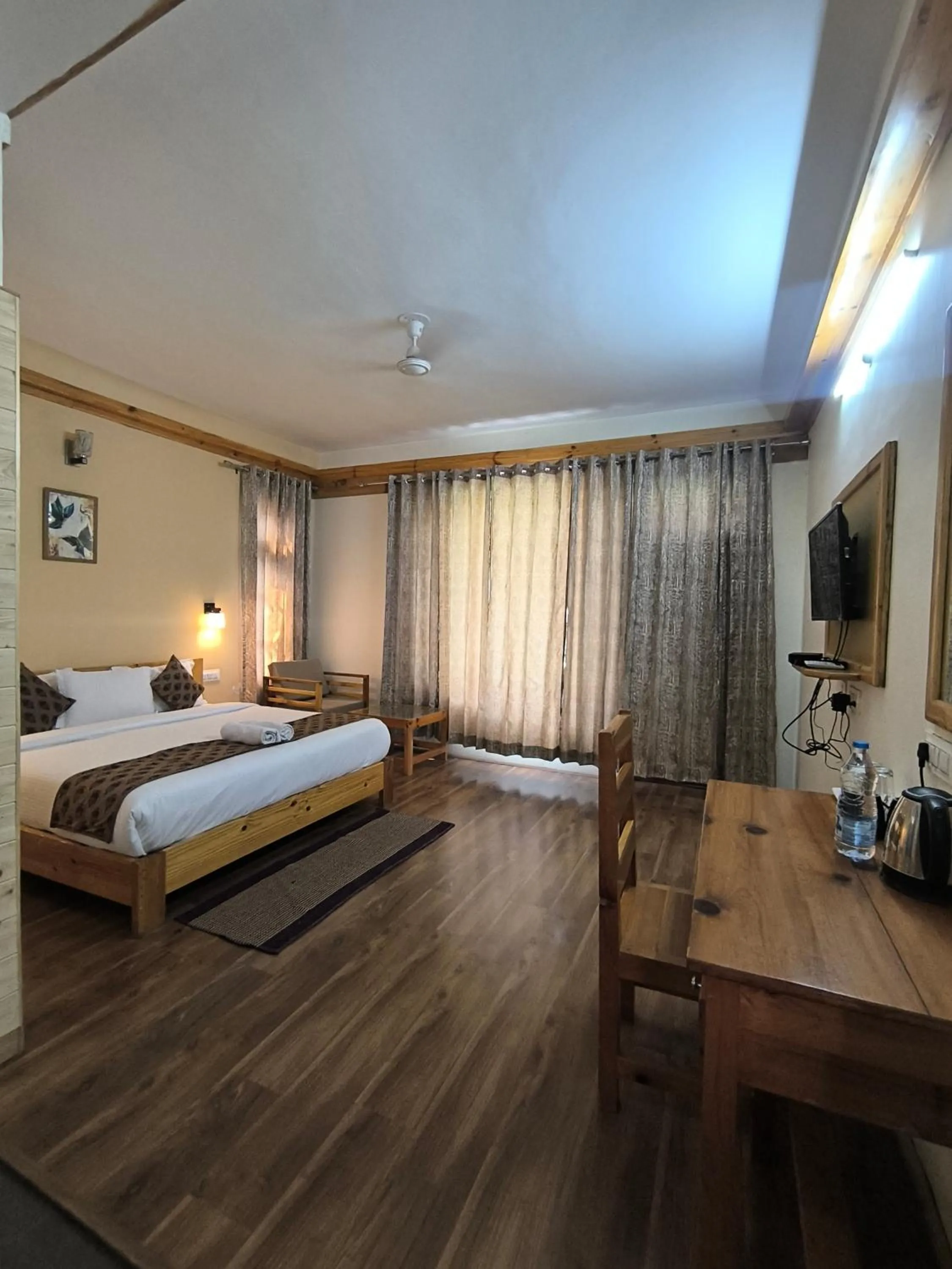 Bed in Tirthan Grand Riverside