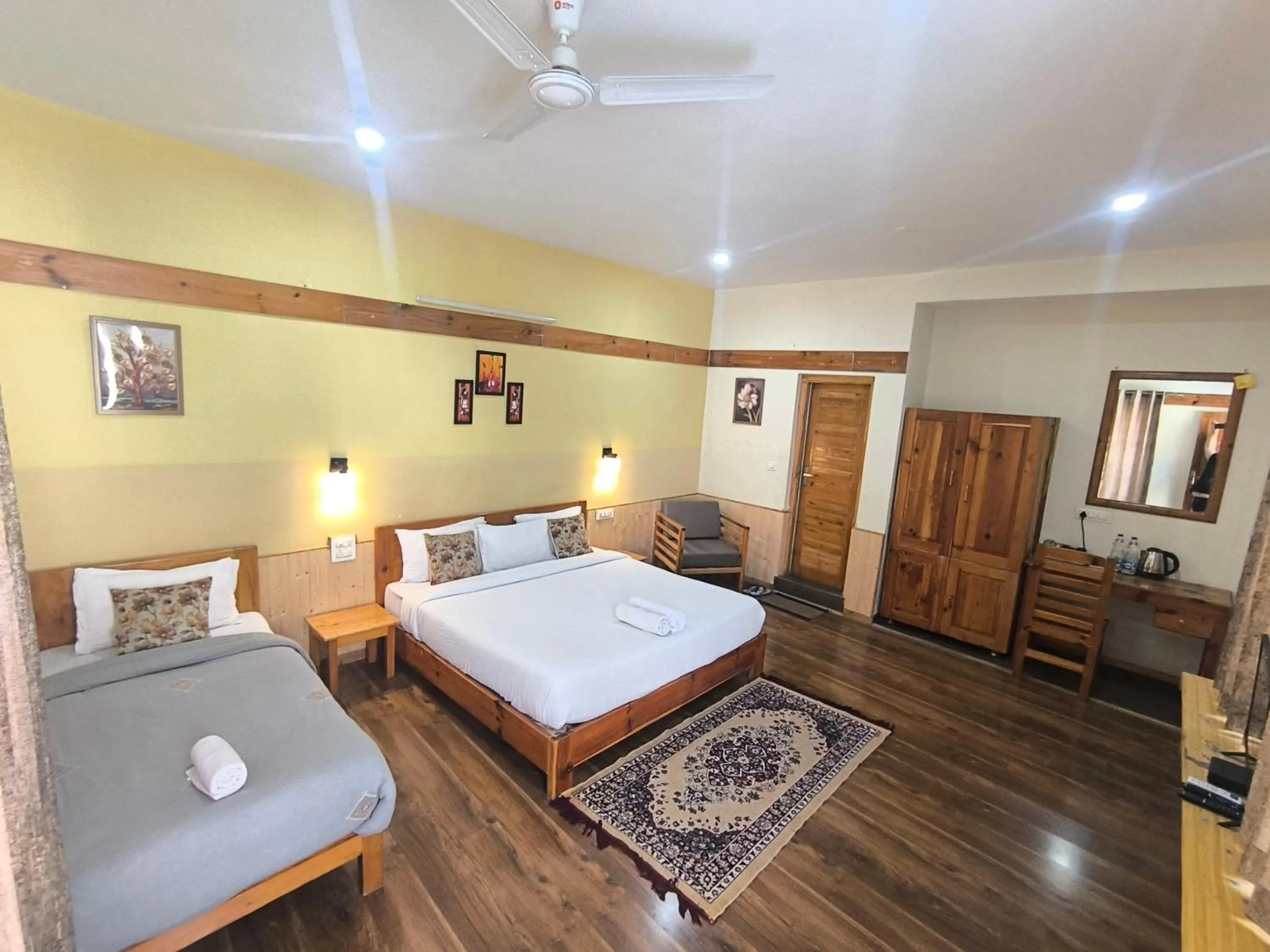 Bed in Tirthan Grand Riverside