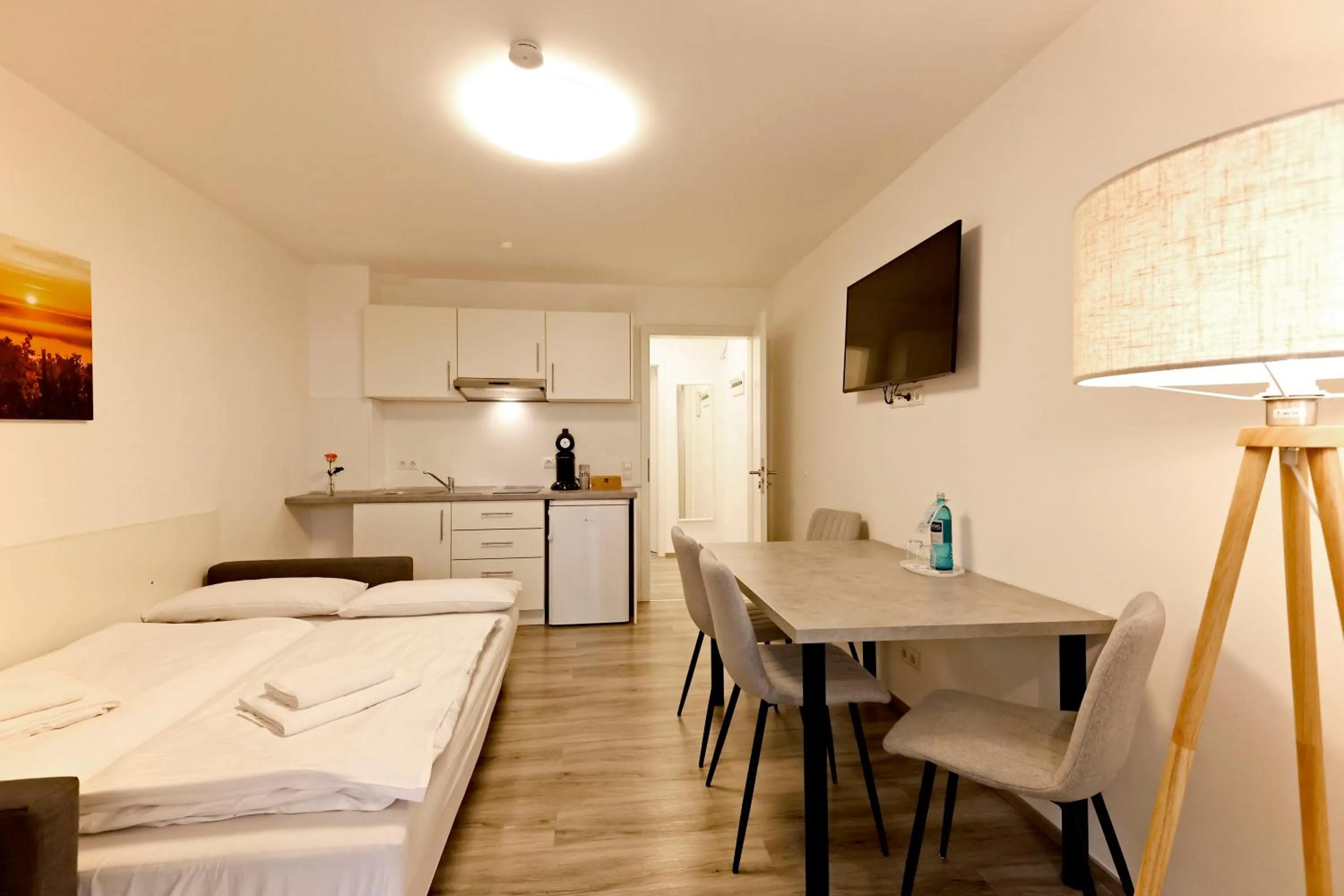 Kitchen or kitchenette, Bed in Vinotel Weinstrasse