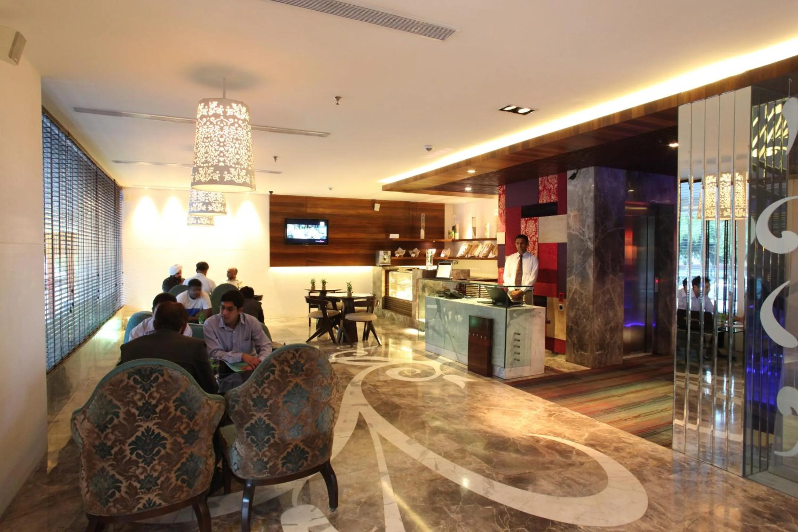 Communal lounge/ TV room in Maya Hotel