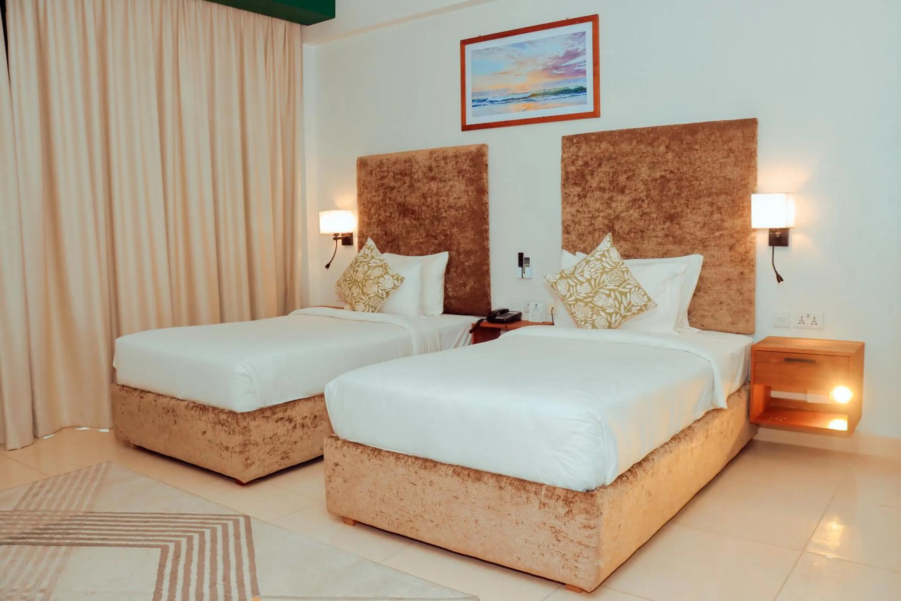 Bed in Best Western Jangwani Sea Breeze Resort