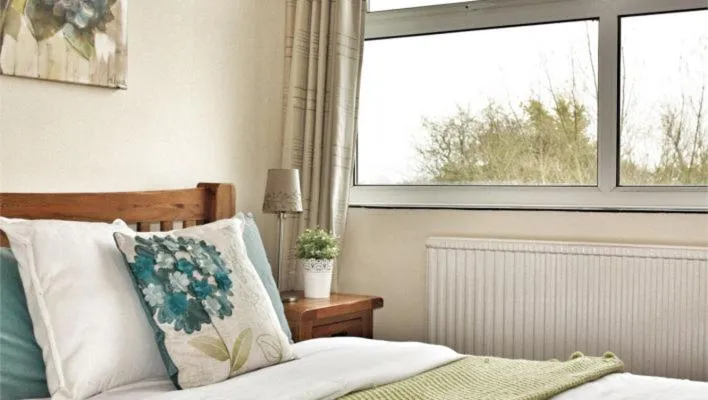 Bed in The Crystal Lodge Hotel