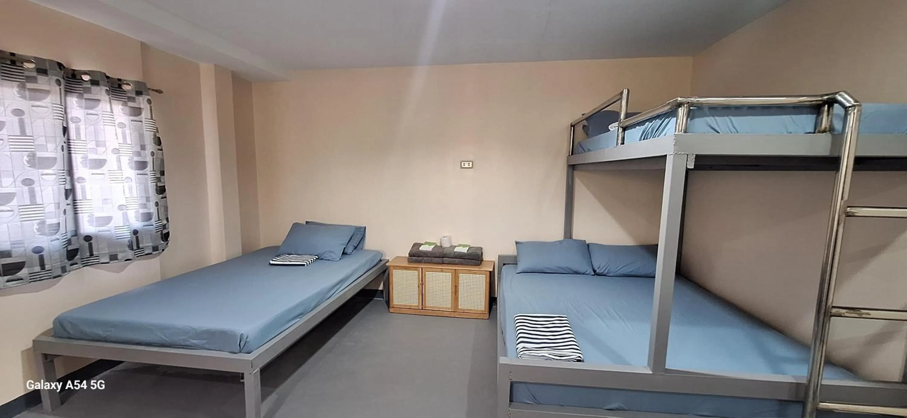 group of guests, Bed in Rain Haven Lodging House