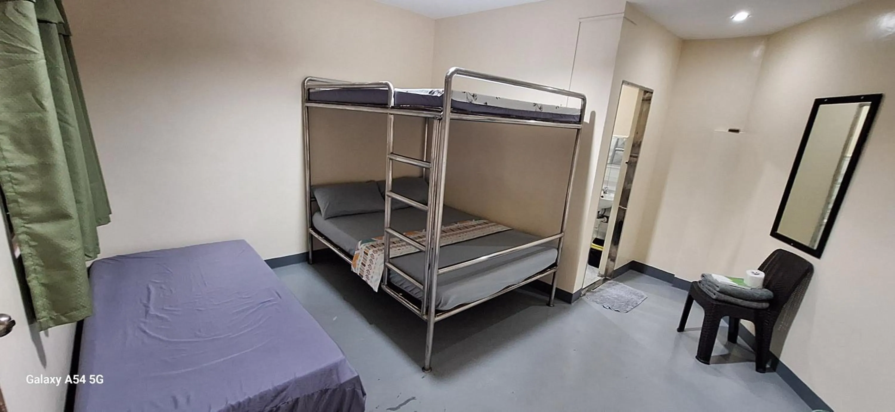 group of guests, Bed in Rain Haven Lodging House