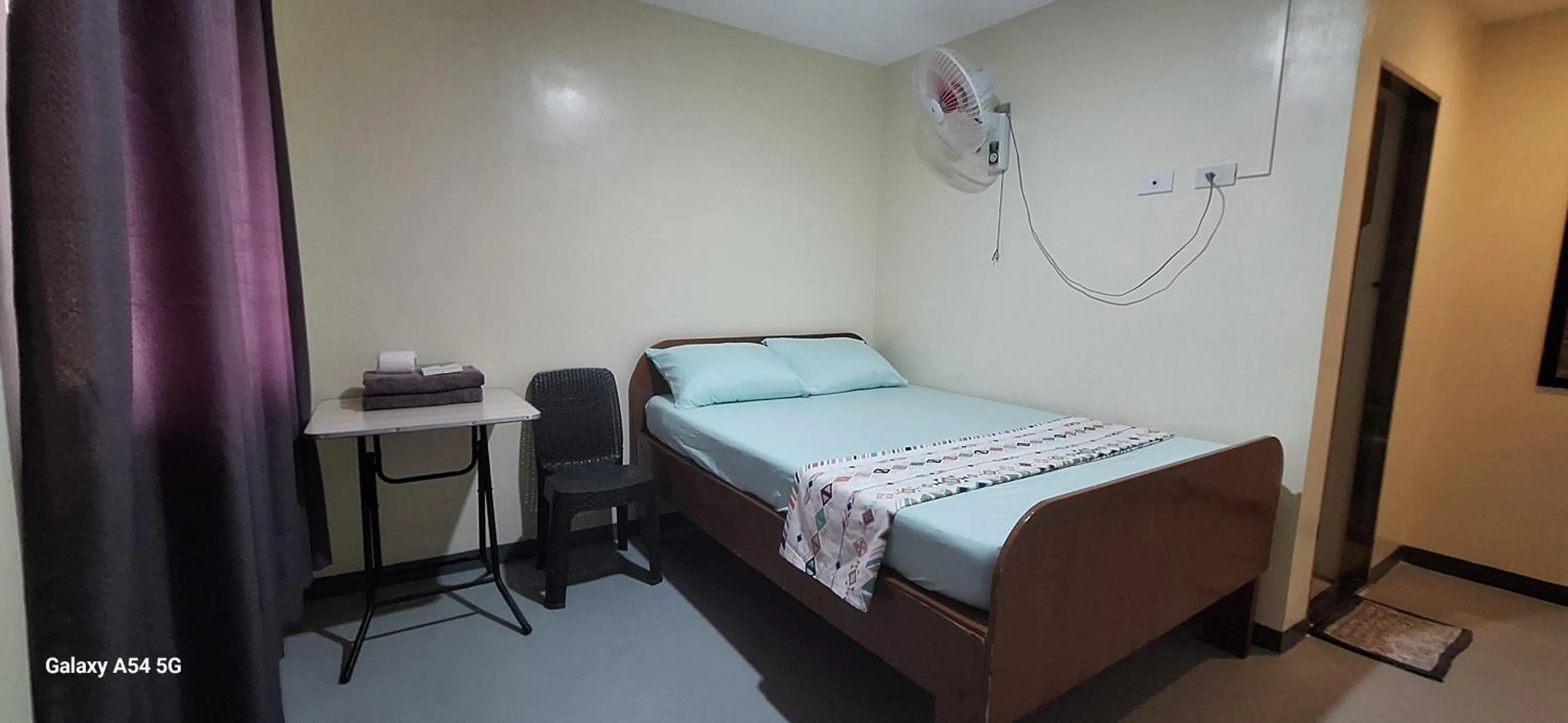 Bed in Rain Haven Lodging House