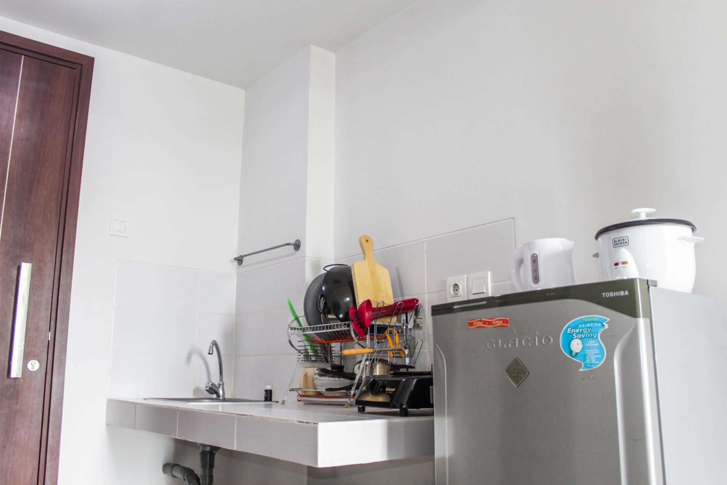 Minimalist and Comfy 1BR Apartment Scientia Residence By Travelio