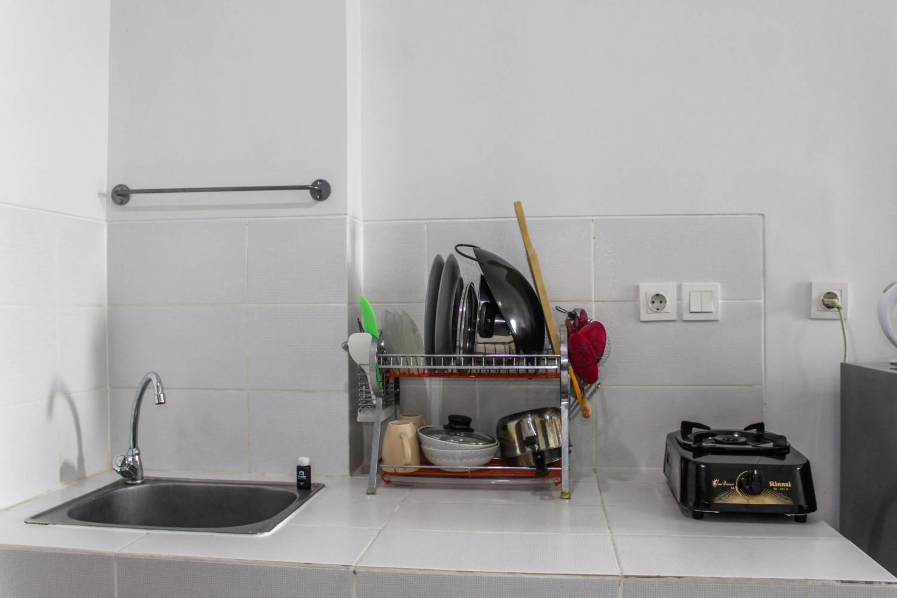 Kitchen or kitchenette in Minimalist and Comfy 1BR Apartment Scientia Residence By Travelio