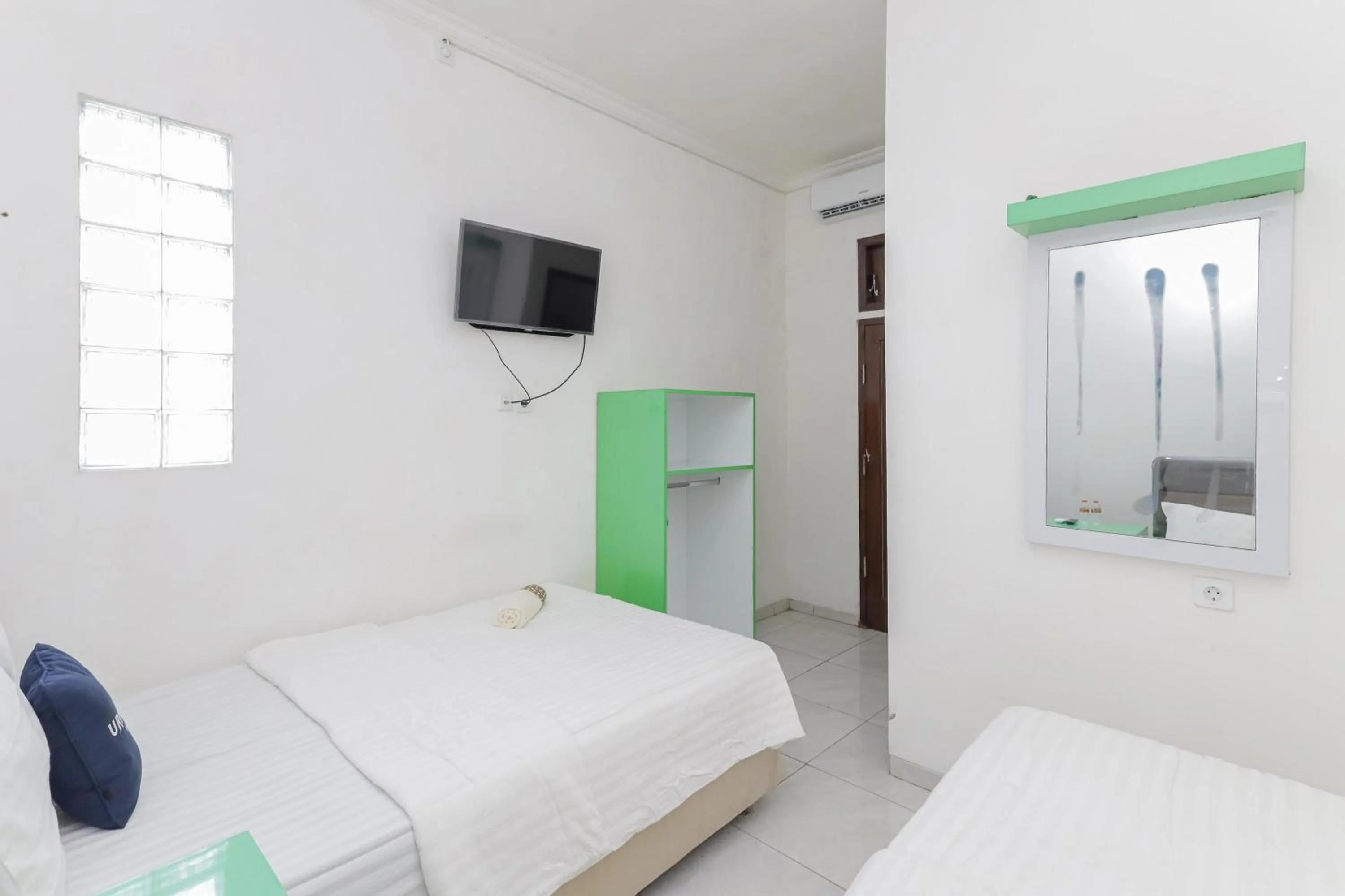 Bedroom in Urbanview Hotel Near Jatim Park 3 by RedDoorz