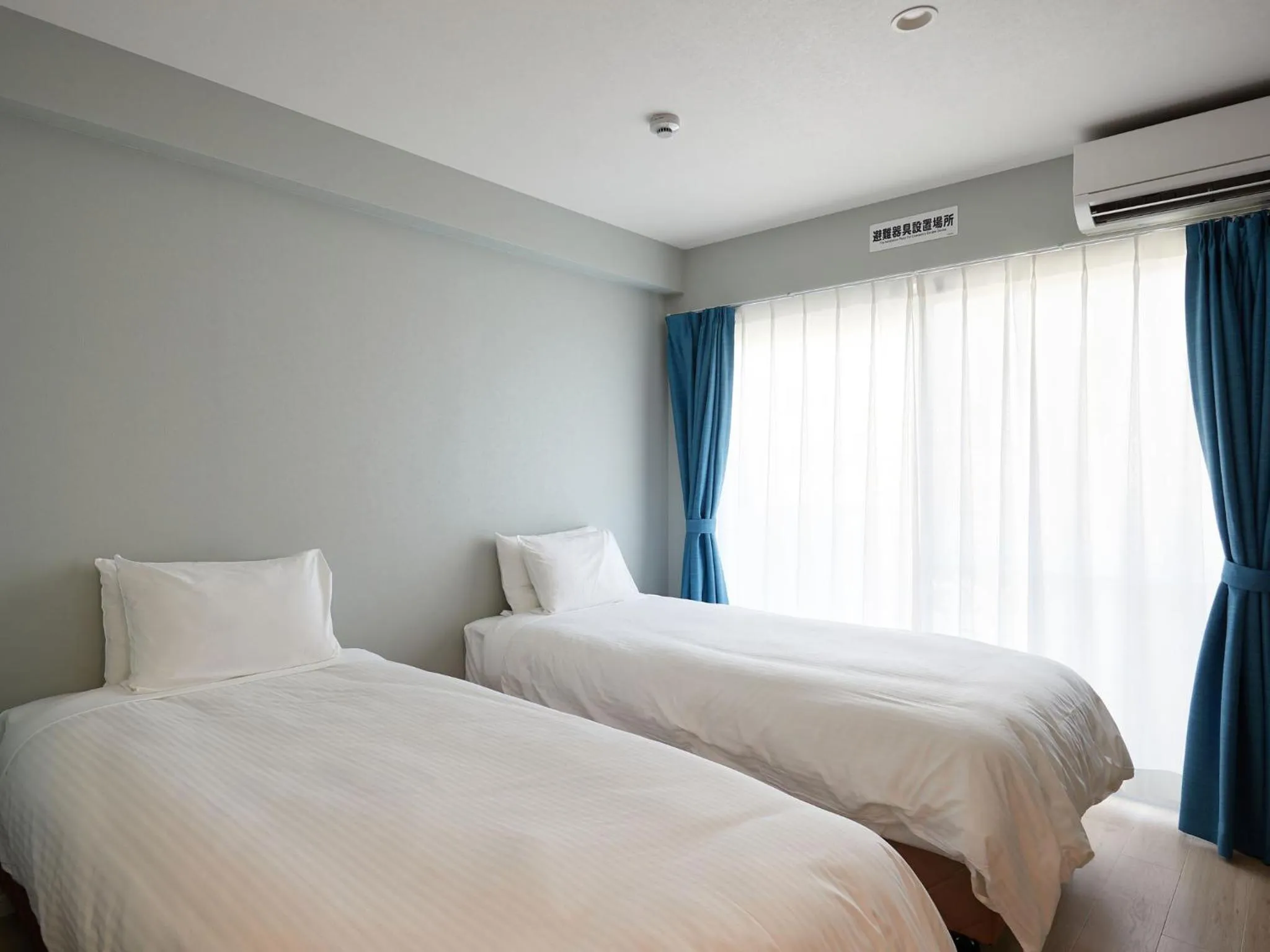 Photo of the whole room, Bed in Tenpoint Hotel OKOU