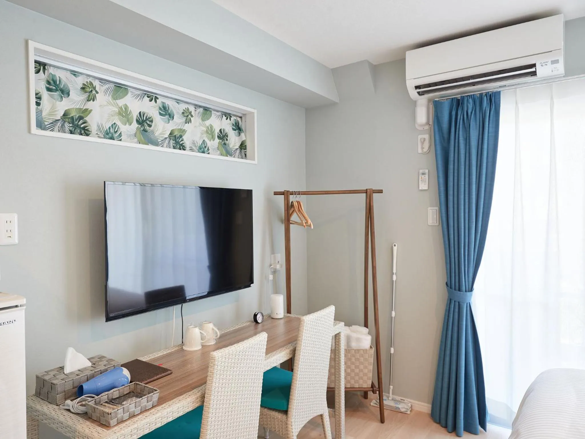 Photo of the whole room, TV/Entertainment Center in Tenpoint Hotel OKOU