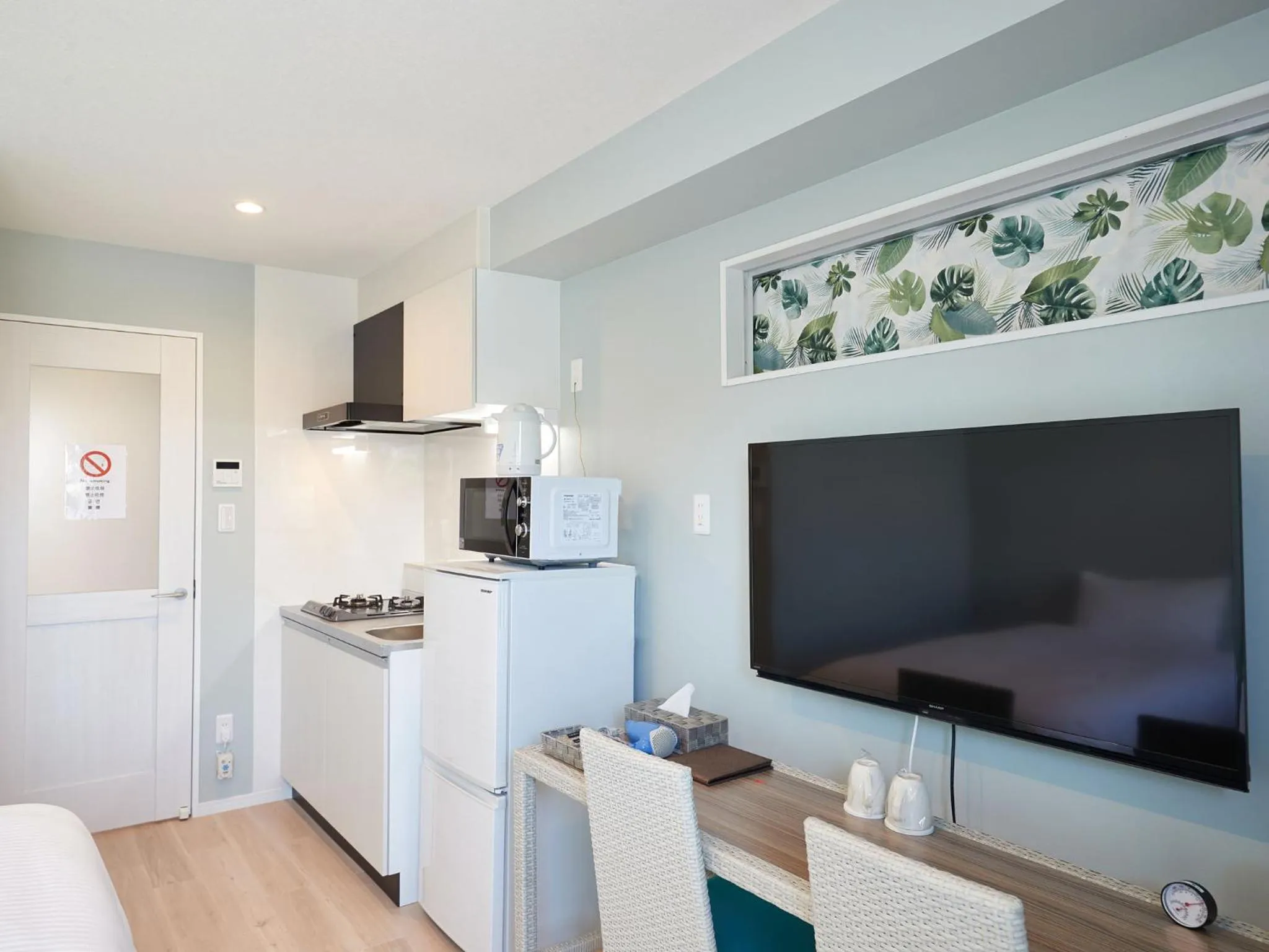 Photo of the whole room, TV/Entertainment Center in Tenpoint Hotel OKOU