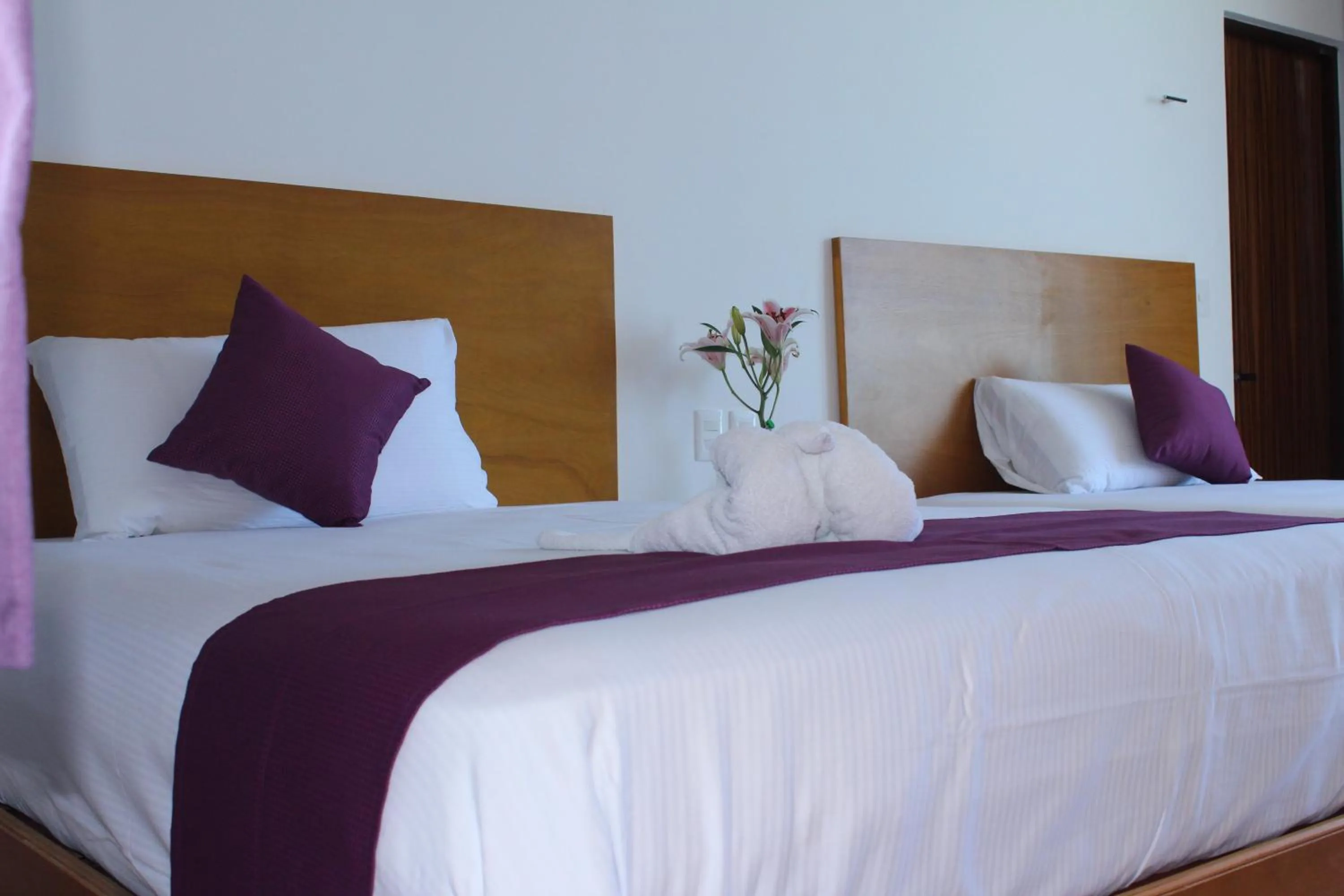 Bed in Yuum Ha Boutique Hotel