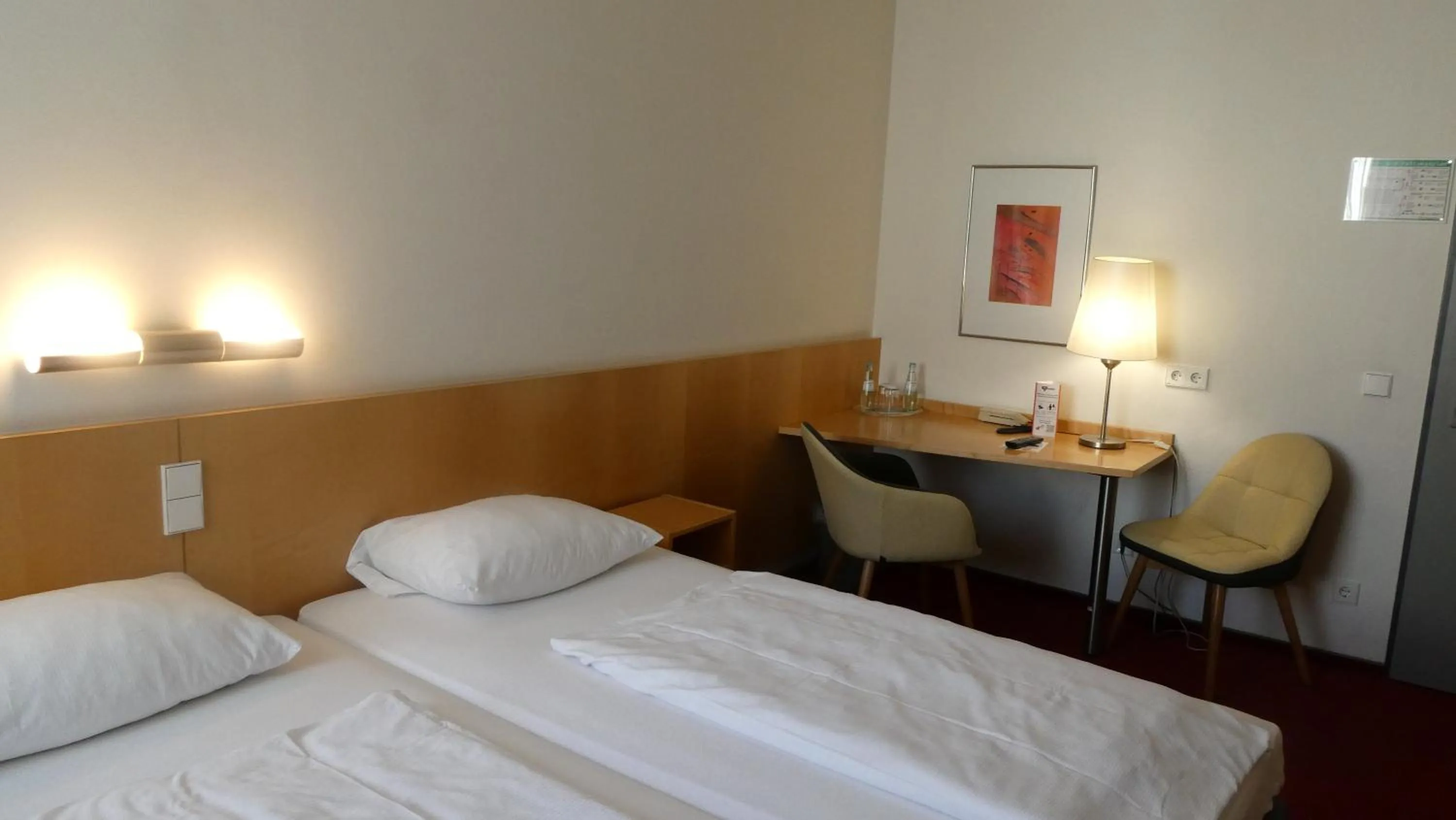 Photo of the whole room, Bed in CVJM Düsseldorf Hotel & Tagung