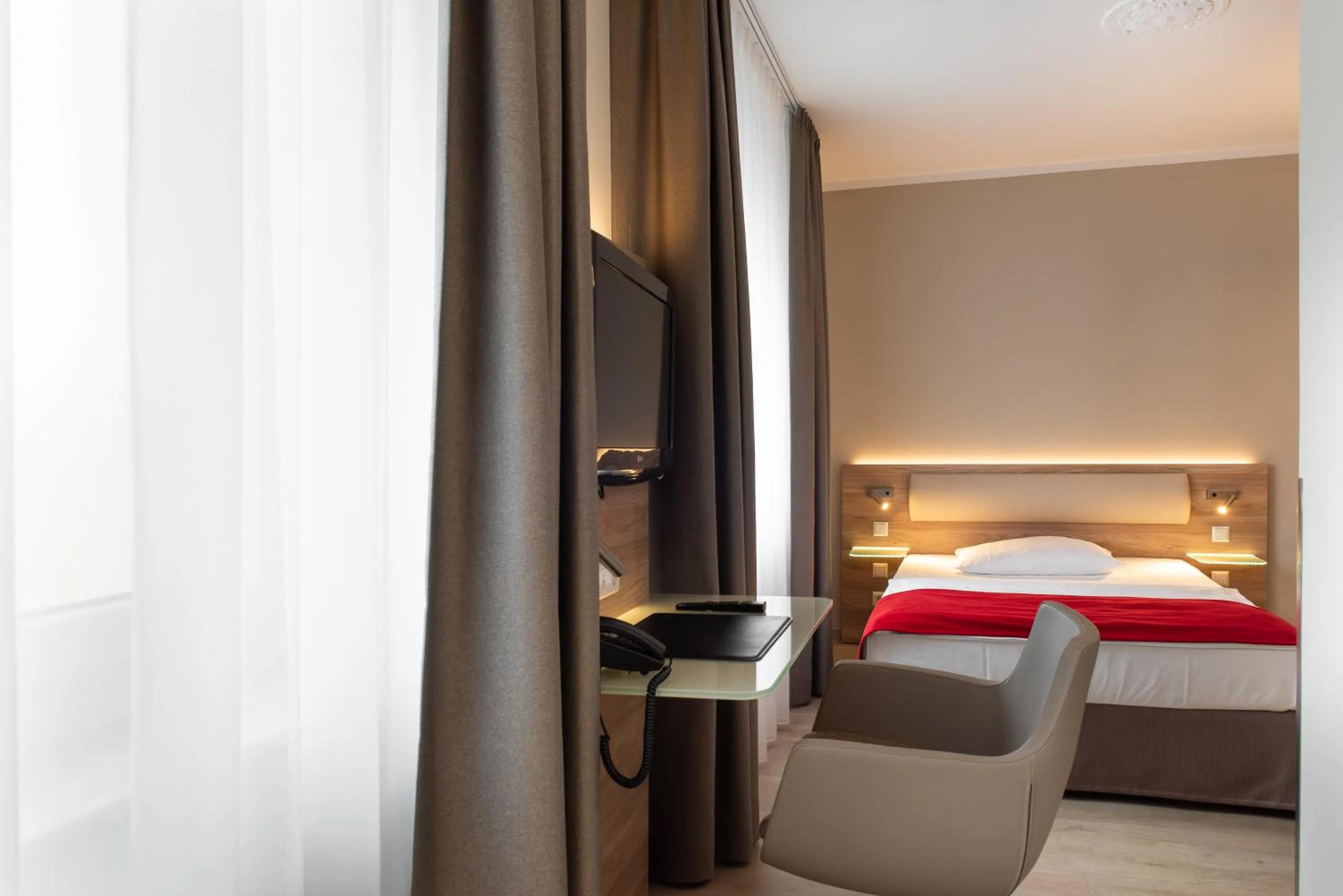 Bed in Hotel Königshof am Funkturm