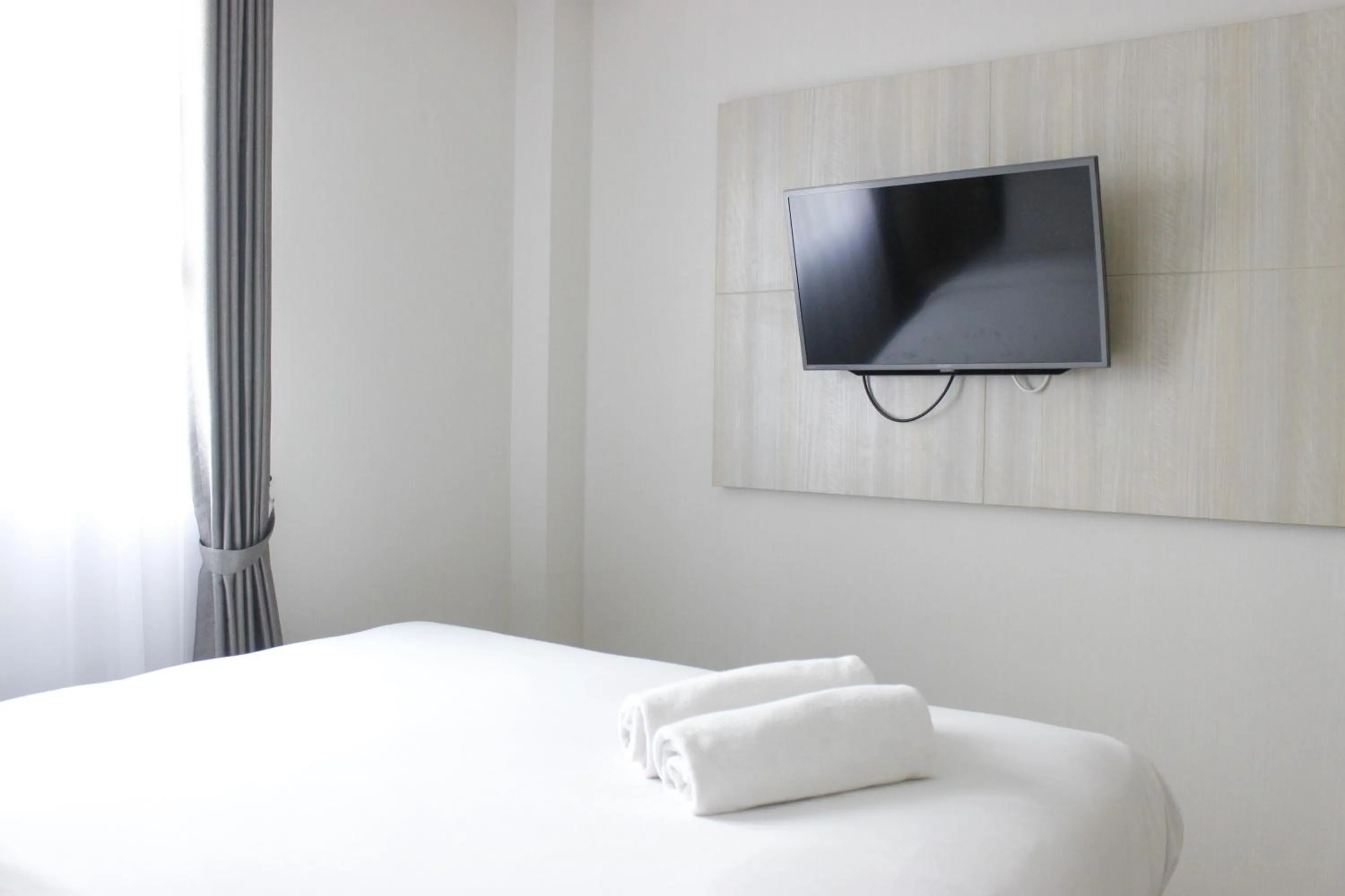 Bright and Stylish 2BR at Gateway Pasteur Apartment By Travelio