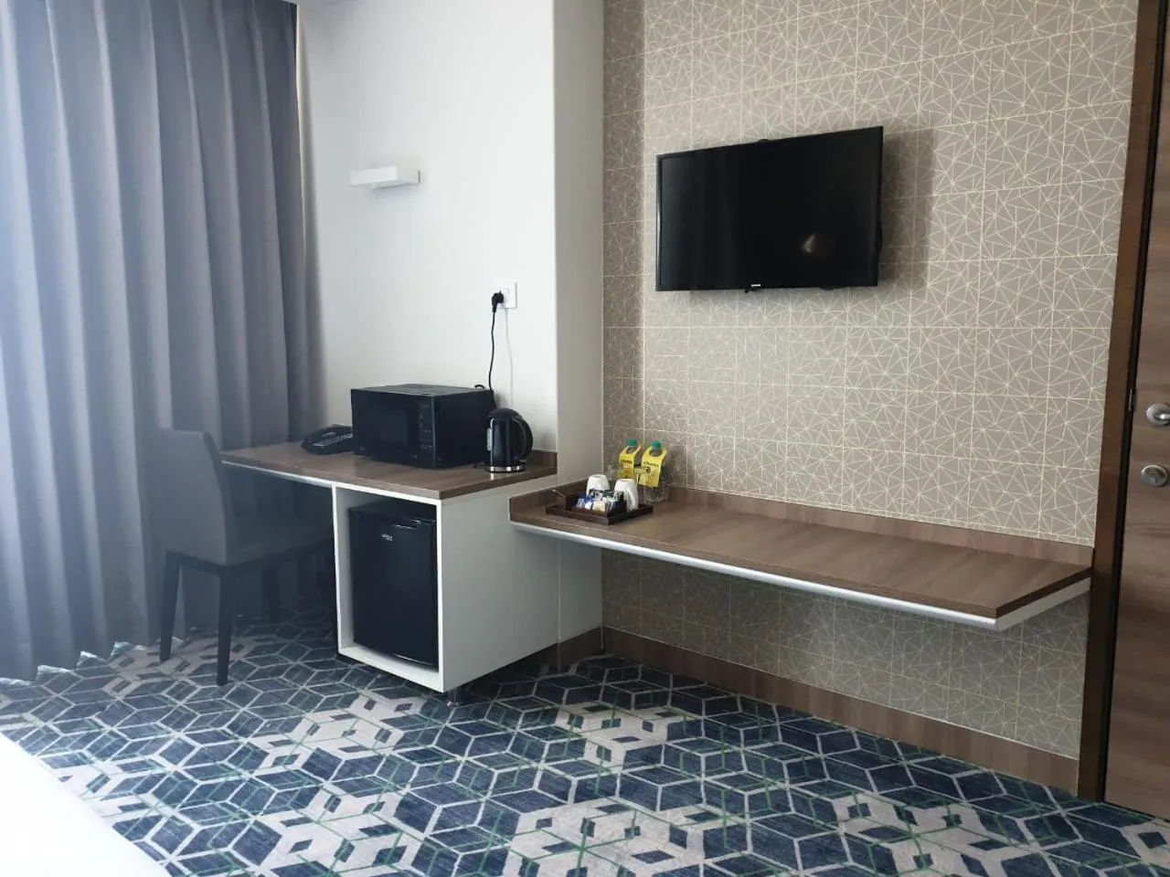 TV and multimedia in Holiday Inn Gurugram Sector 90 by IHG