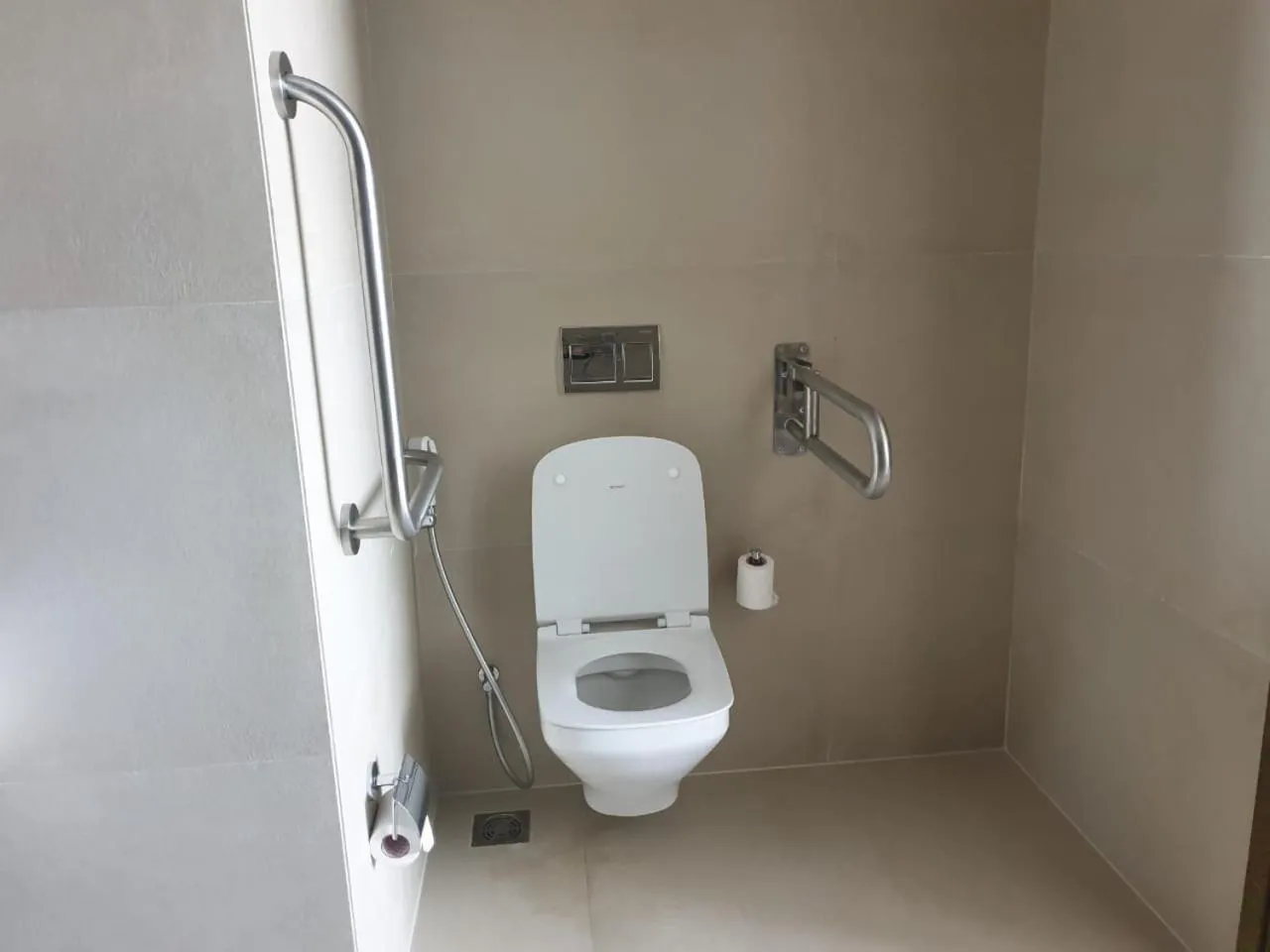 Toilet in Holiday Inn Gurugram Sector 90 by IHG