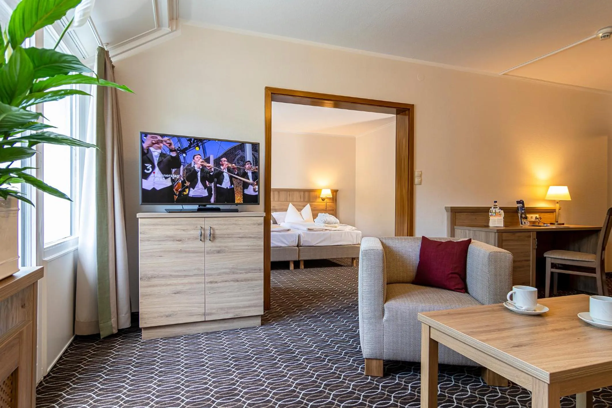 Living room, Bed in AMBER HOTEL Bavaria Superior