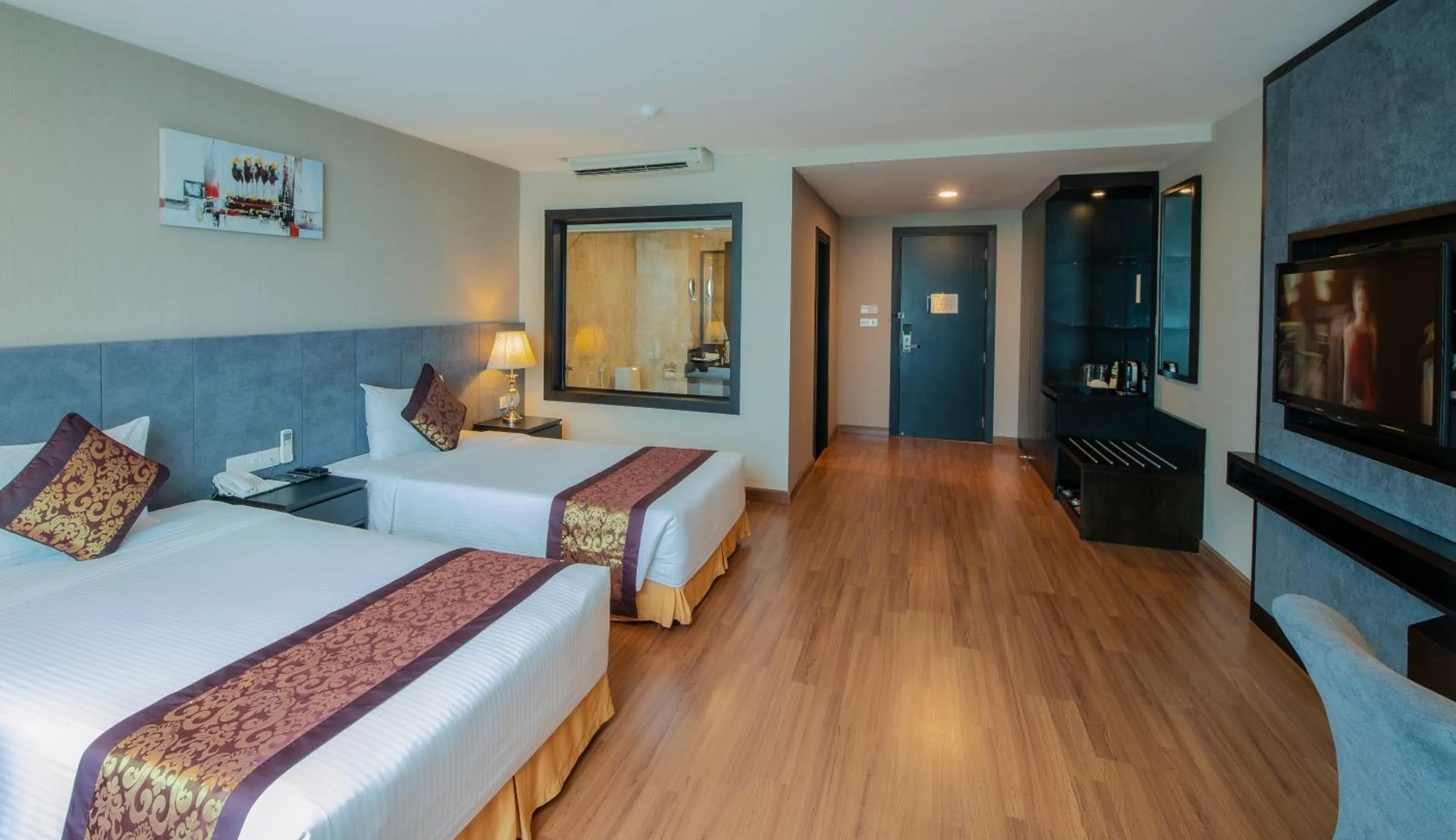 Communal lounge/ TV room, Bed in Muong Thanh Grand Da Nang Hotel