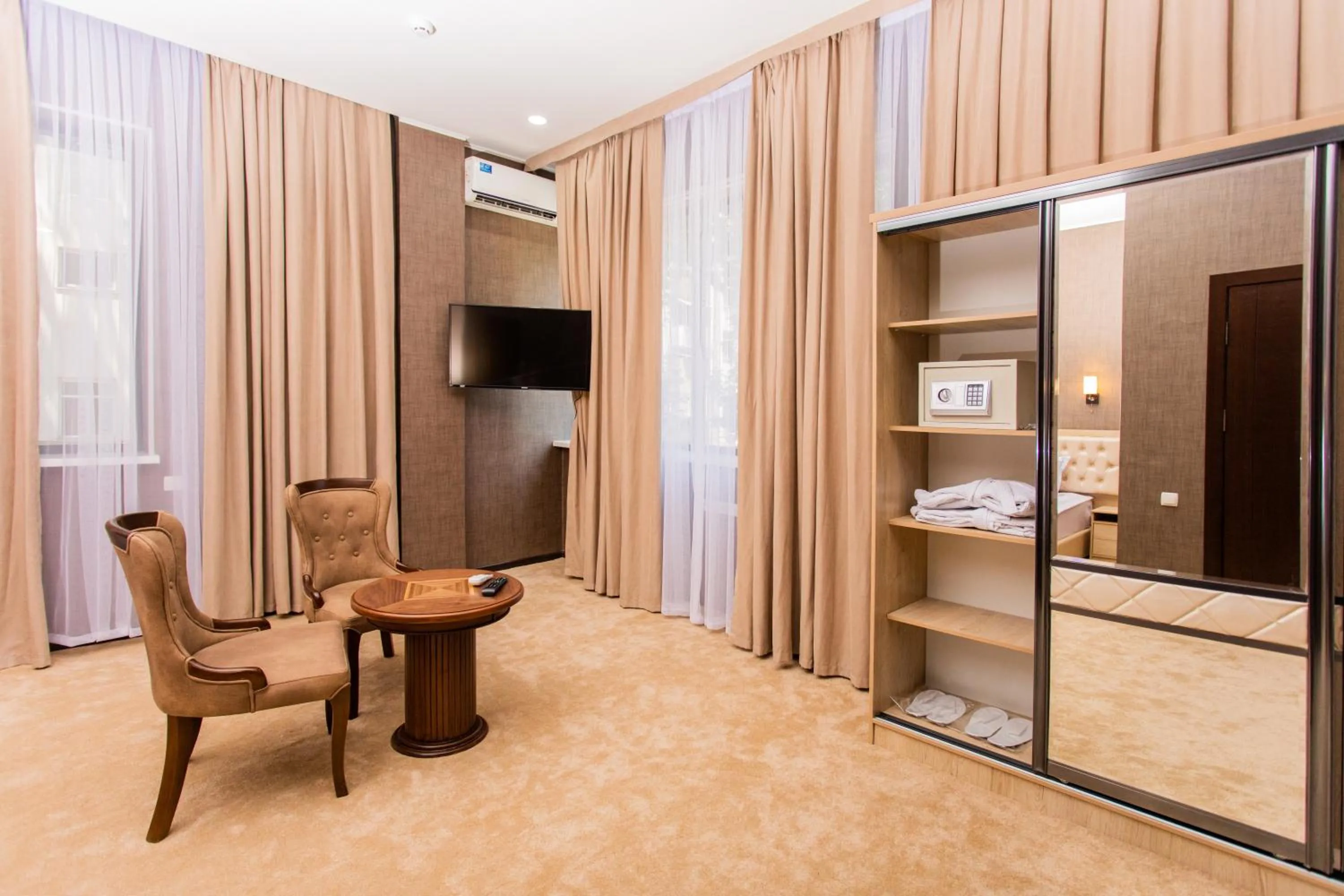 Communal lounge/ TV room in Gabrielle International Hotel