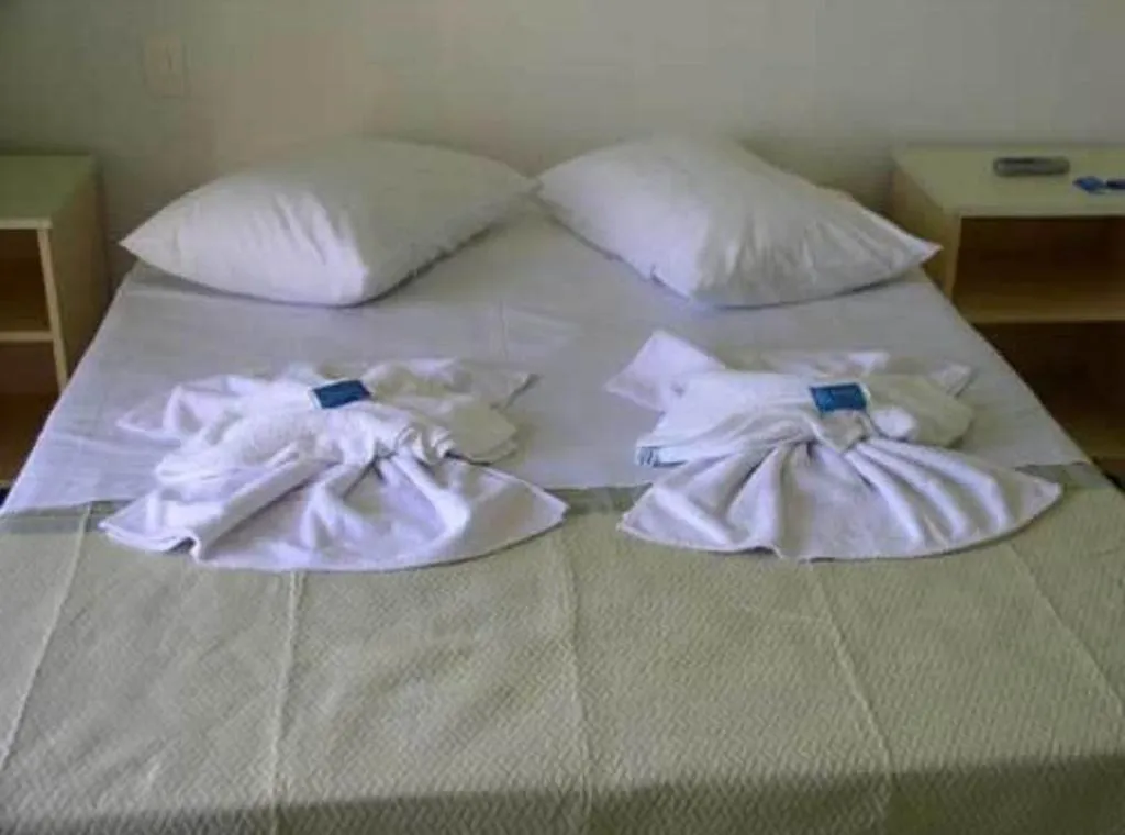 Bed in Hotel Pousada Mineirinho