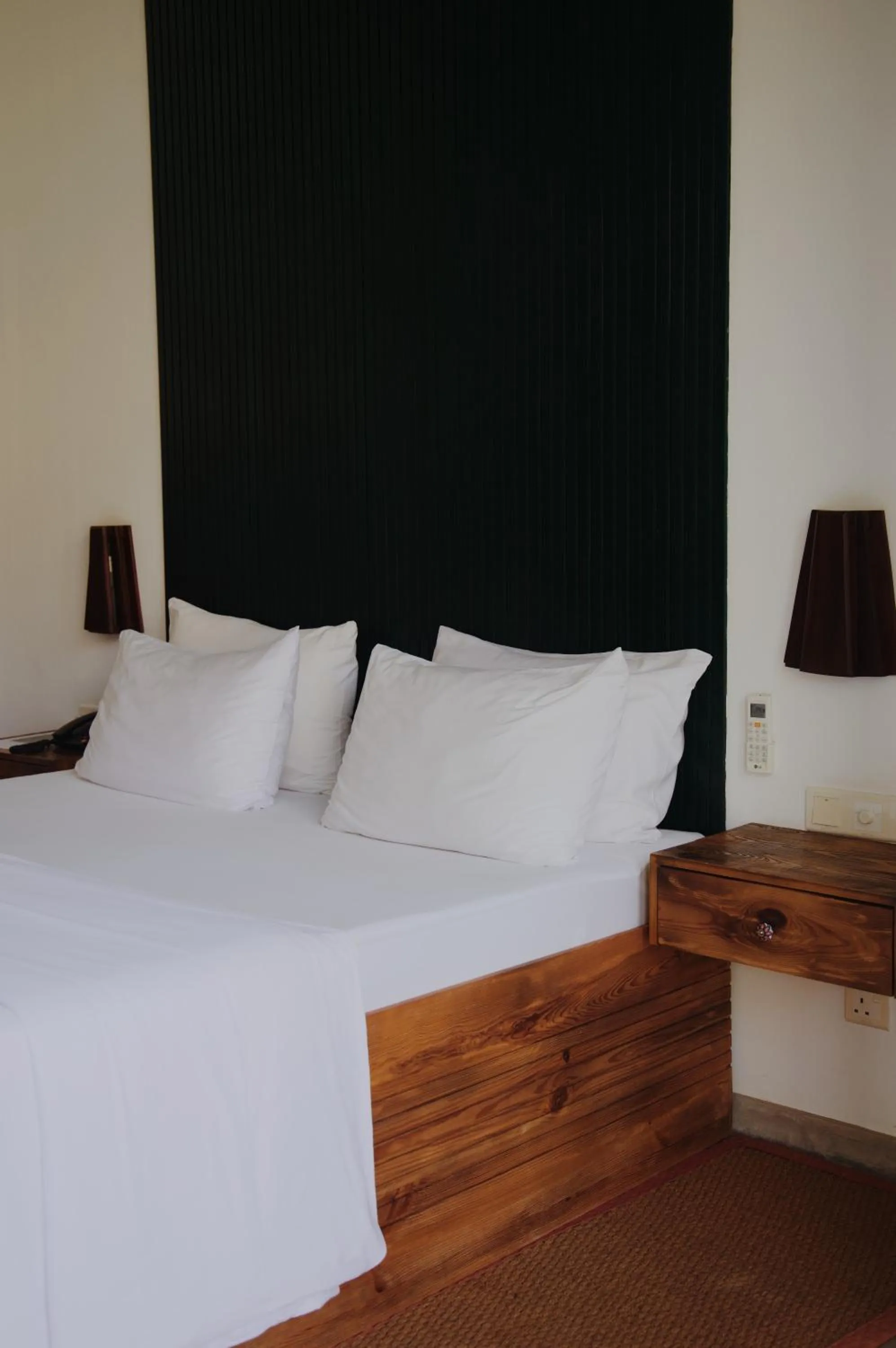 Bed in Palm Garden Ayurveda Resort