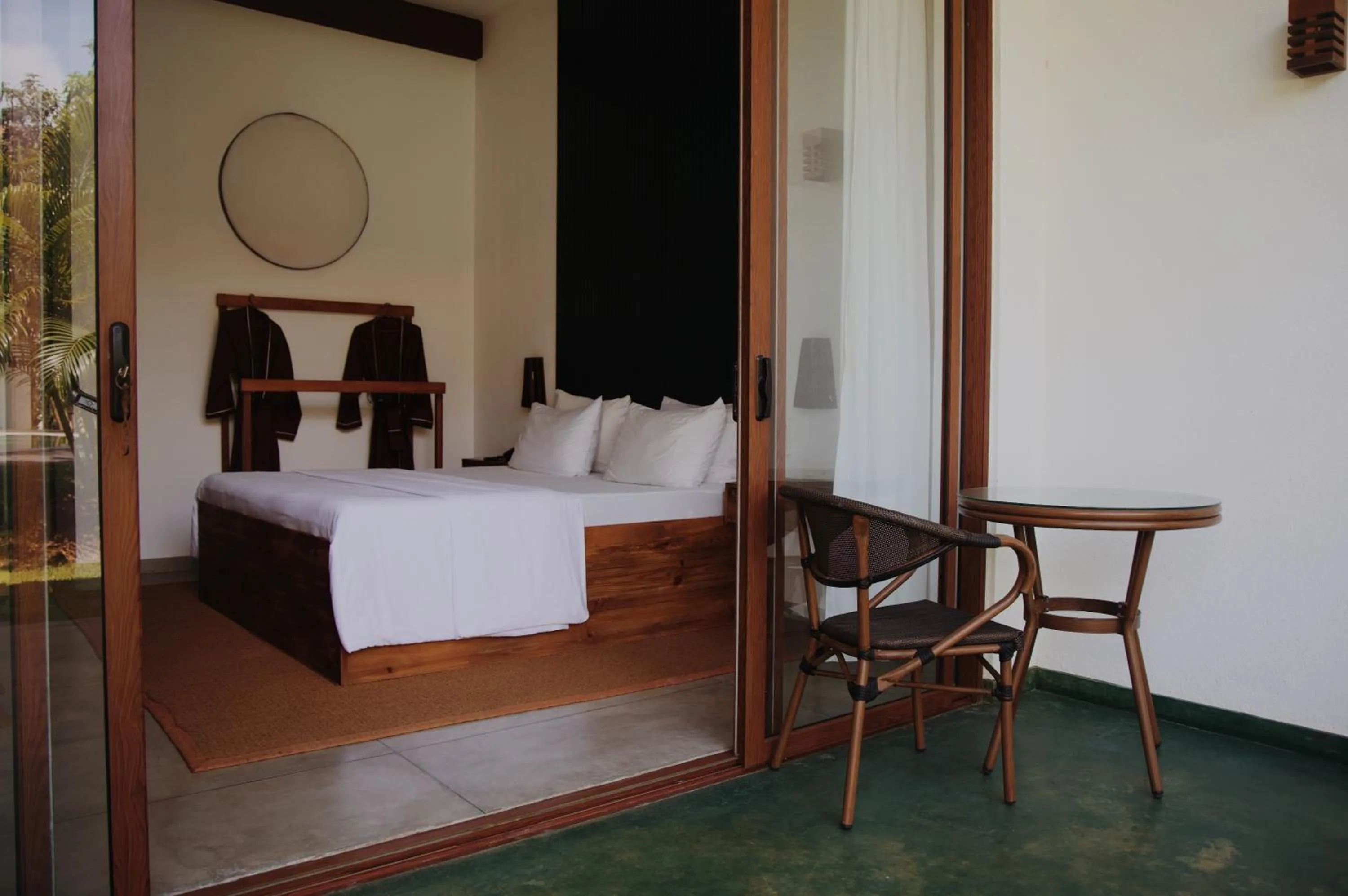 Bed in Palm Garden Ayurveda Resort