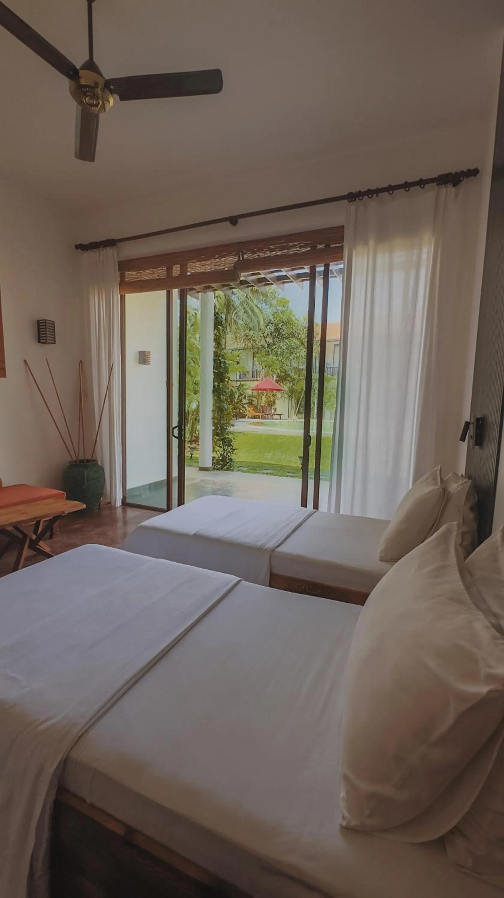 Bed in Palm Garden Ayurveda Resort