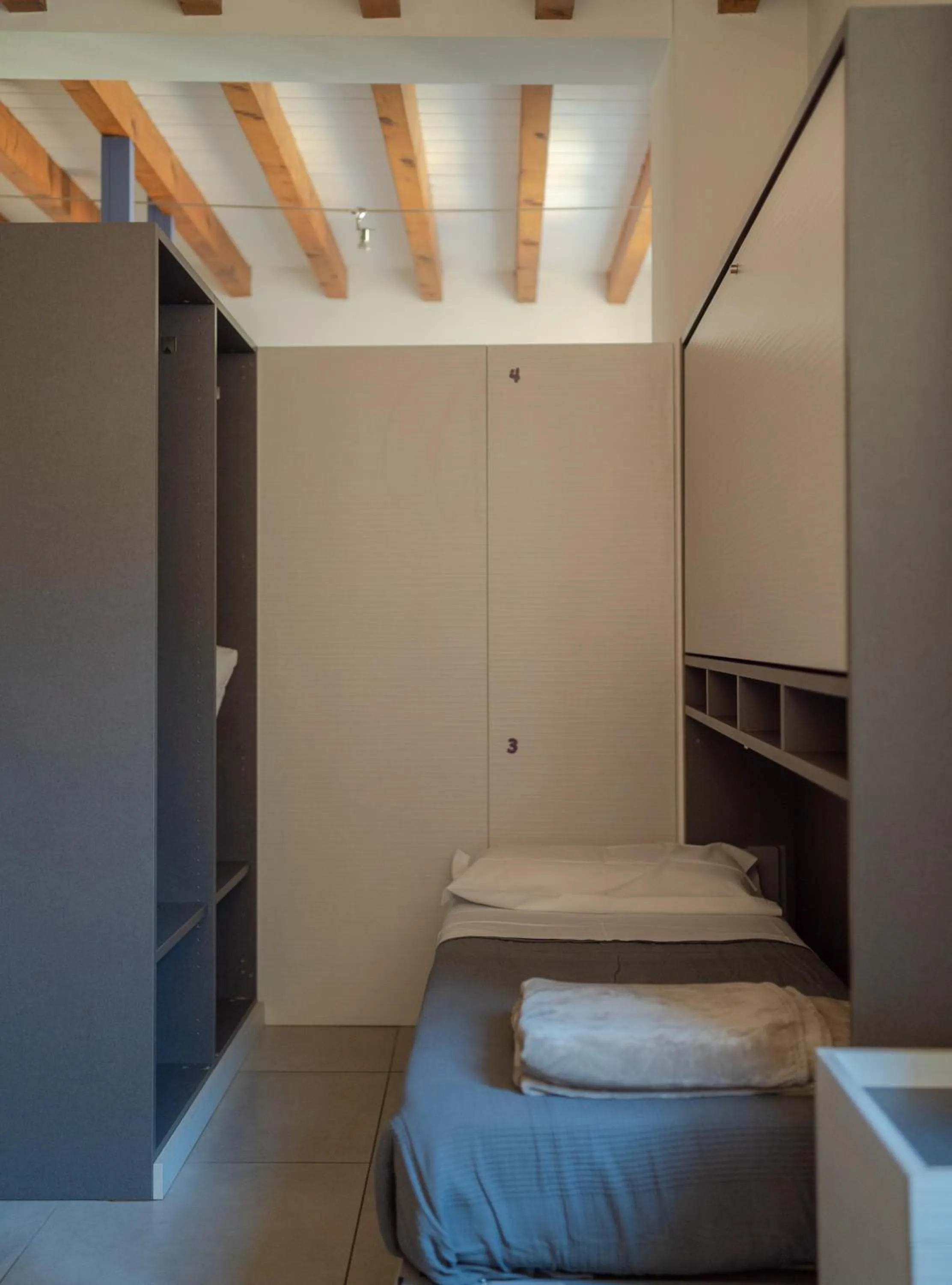 Photo of the whole room in LUOGO COMUNE Ostello