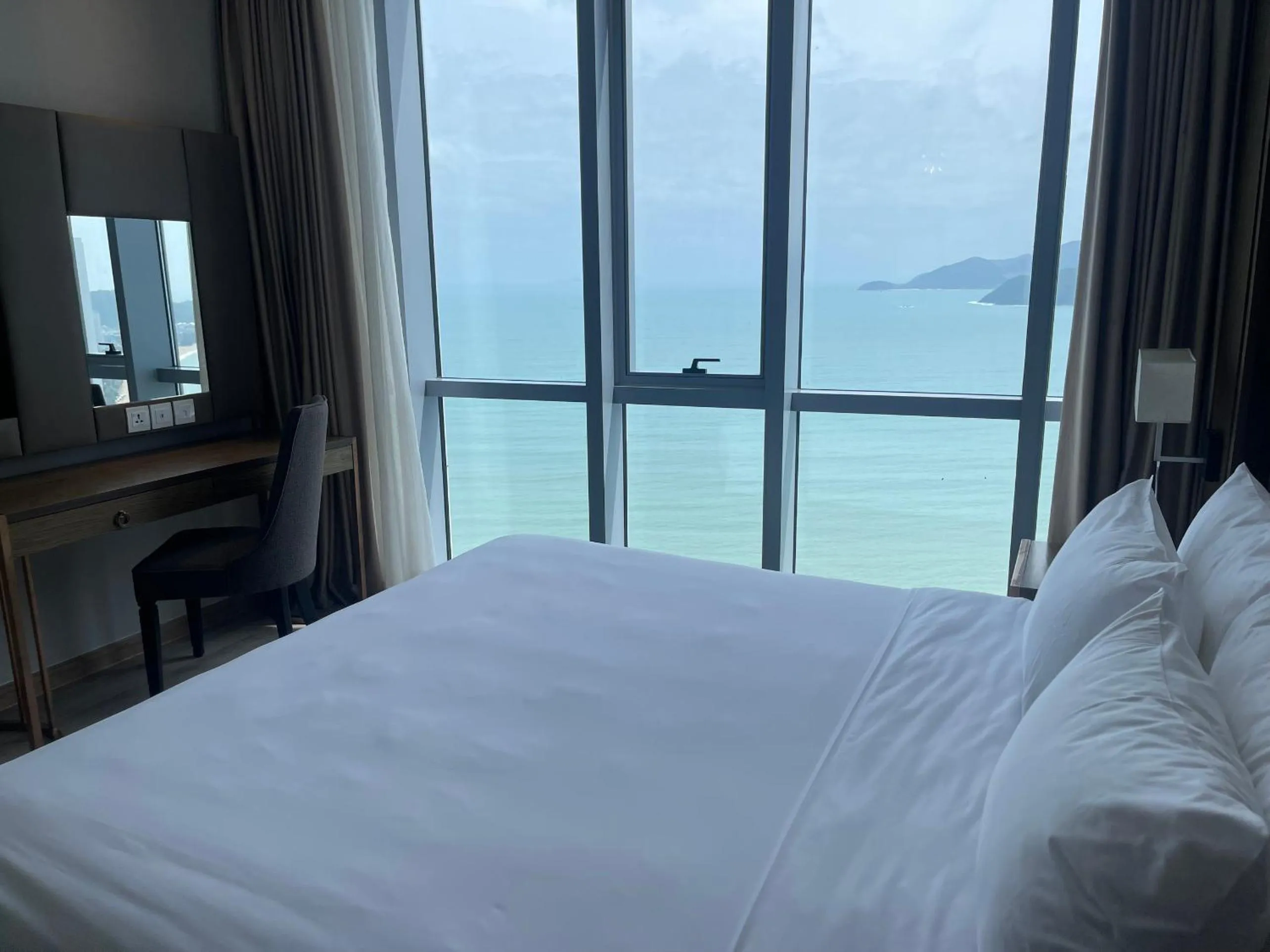 Bed in PANORAMA Condotel by HLG