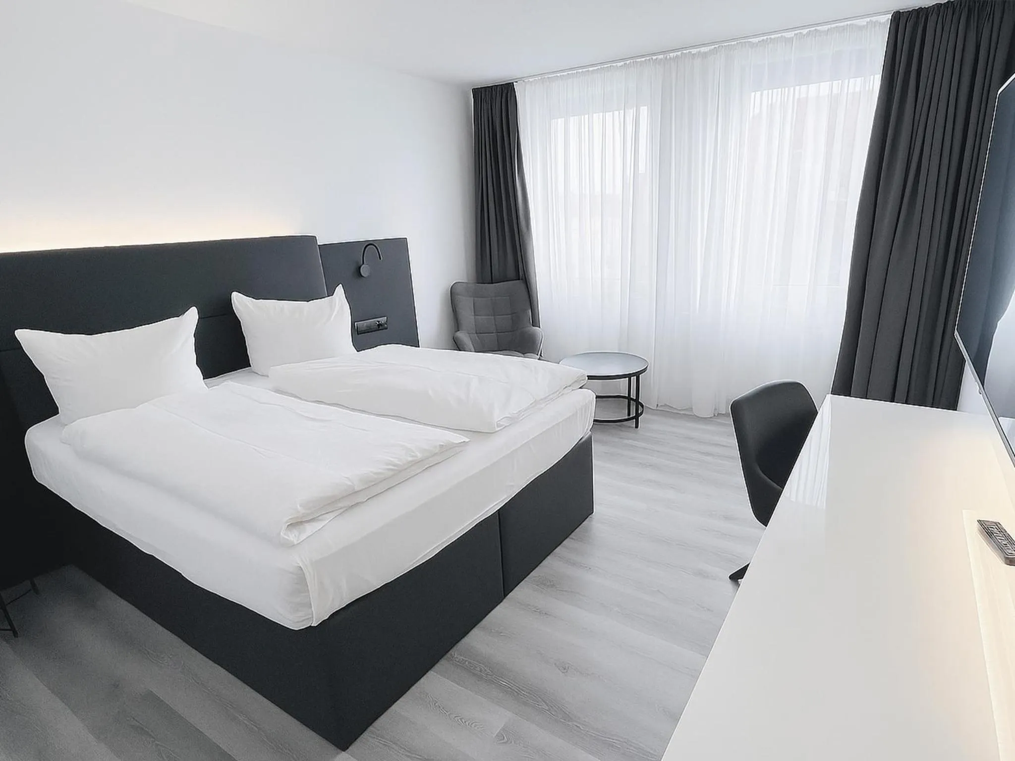 Photo of the whole room, Bed in DORMERO Hotel Dessau-Roßlau