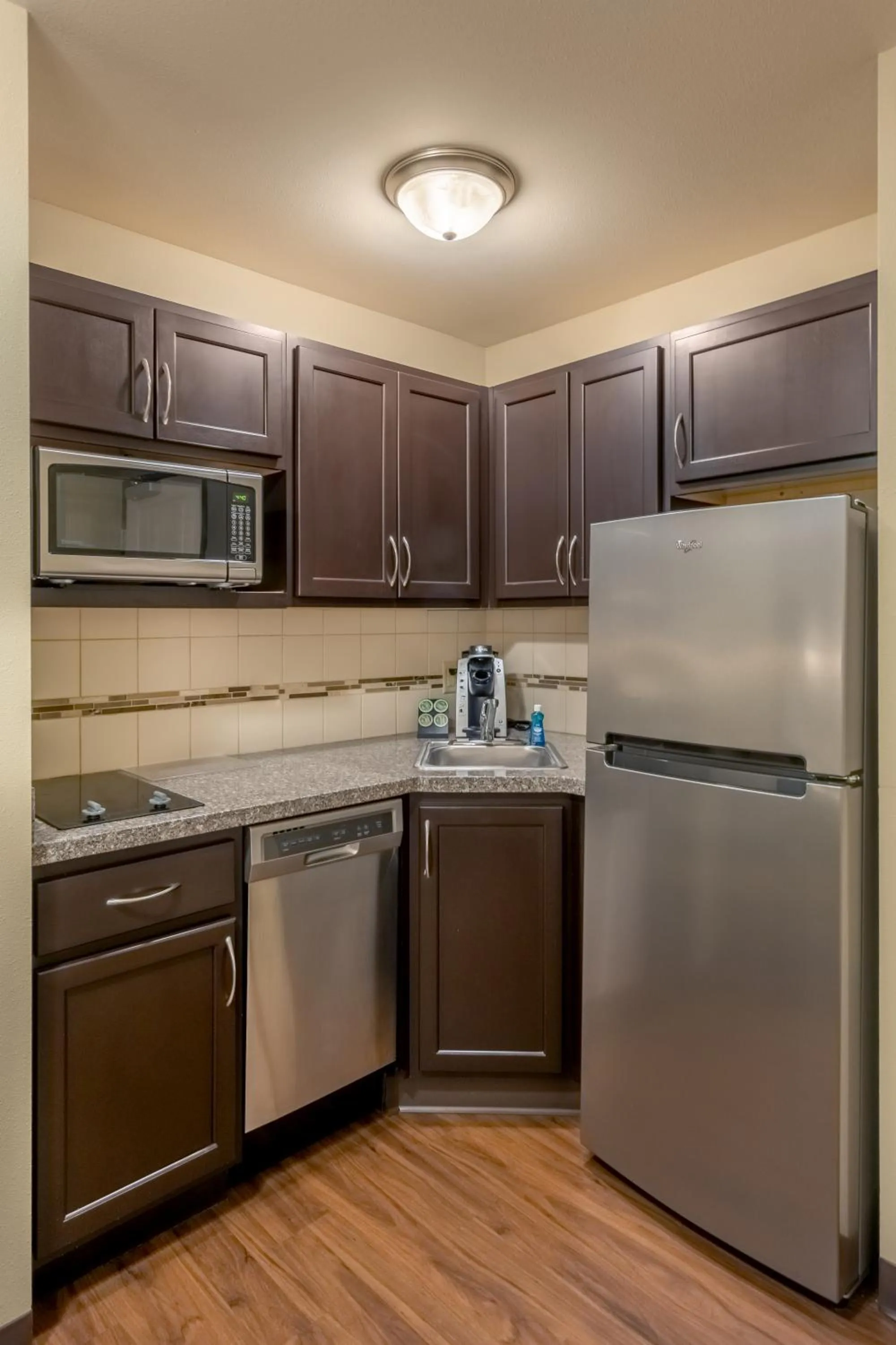 Kitchen or kitchenette in Landmark Suites - Williston
