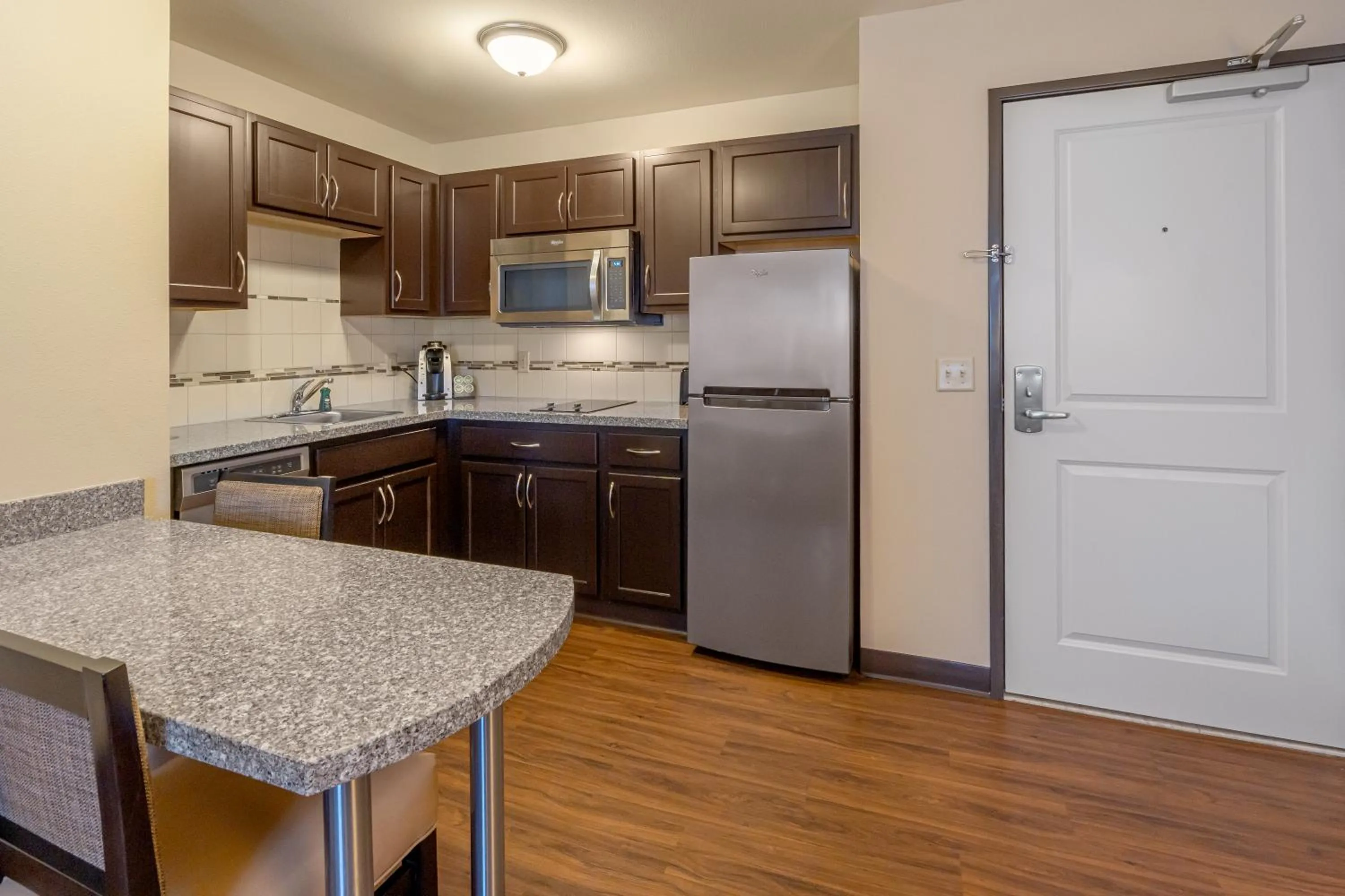 Kitchen or kitchenette in Landmark Suites - Williston